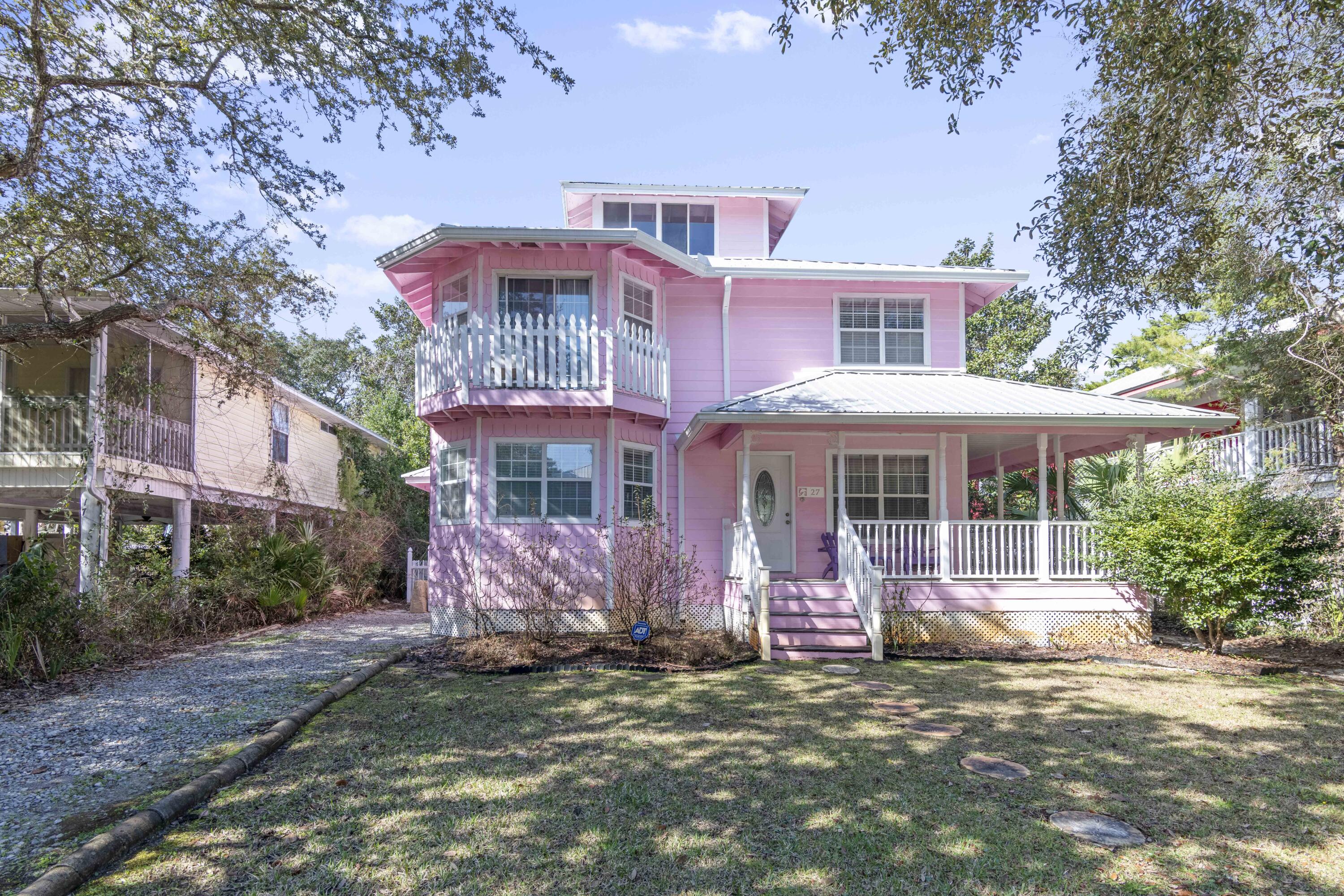A quaint Victorian beach cottage in the heart of Seagrove, 27 Dalton is ideally located just a few blocks from the Eastern Lake Regional Beach Access. The sunny ground floor living area leads to a screened back porch that has been lovingly used for many years. The primary suite on the second floor has an en-suite bath and dressing area, and two other bedrooms on the second floor share a hallway bath. The third floor tower offers 270-degree views of the treetops of Seagrove. A fenced back yard with heirloom azalea and camelia bushes is kept lush by an in-ground sprinkler system.