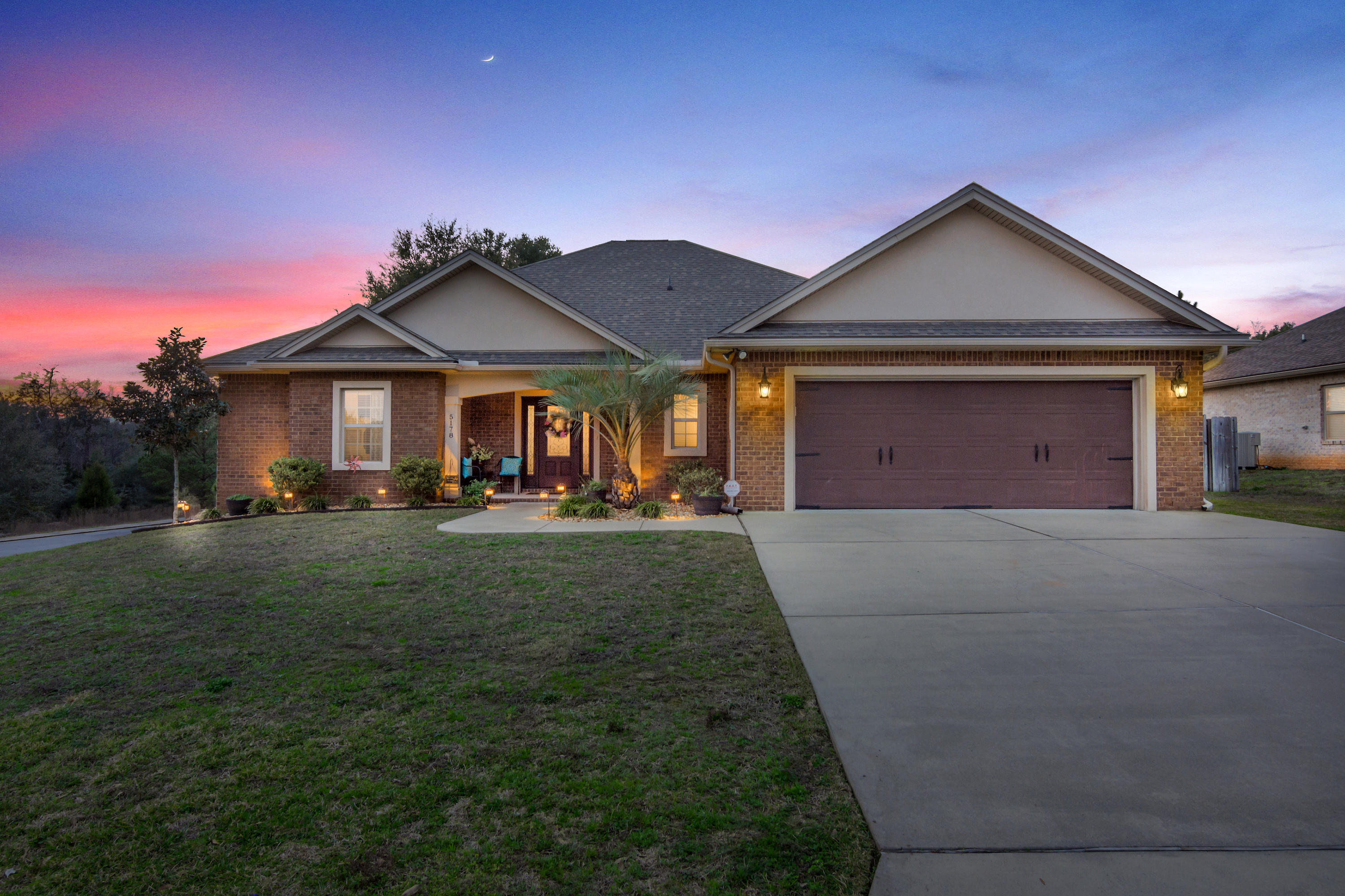 Welcome Home to this Exquisite Brick Beauty! This open split floor plan offers efficiency and luxury! Inviting front porch welcomes you into the foyer with coat closet, built in bench and handscraped hardwood floors. Spacious great room with high ceilings, beautiful built-in bookcases opens into the family room with electric fireplace, built in shelves (or benches) and pocket doors if you need to separate the living spaces. Separate sound systems in each living area. Gorgeous kitchen features custom cabinets, granite countertops and breakfast bar, double ovens, smoothtop stove and built in microwave. Above & below cabinet lighting, porcelain tile in all wet areas, pantry has custom shelves and laundry room offers built in cabinets.