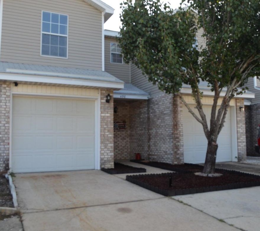 Perfect investment opportunity or starter home! Located Less than a mile from the main gate of Hurlburt Field AFB. Spacious unit with tile flooring and a half bathroom downstairs. Large master bedroom with double closet and full bath. Guest bedroom has lots of closet space and private bathroom as well. Fenced back patio area with no grass perfect for grilling on summer nights. Less than 10 min ride to beautiful white sand beaches!