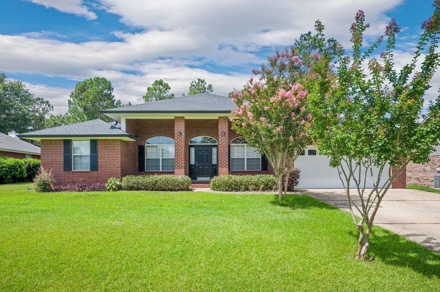 Perfectly located 4 bedroom home in South Crestview! This property will wow you as you pull up and see the amazing curb appeal and large yard. Step inside and enjoy the open floor plan, hard floors in all main areas, vaulted ceilings, and neutral walls. This home boasts an office and formal dining room as well as a breakfast bar and eat in kitchen area. The master suite is spacious, featuring walk in closets, entry to exterior porch,  trey ceiling, ceiling fan, double vanities, walk in shower, and separate jacuzzi tub. Three additional bedrooms area spacious and located in split format for privacy. The backyard is fenced and home has sprinkler system. This property also boasts a 2 car garage, covered back porch, and coved front porch.