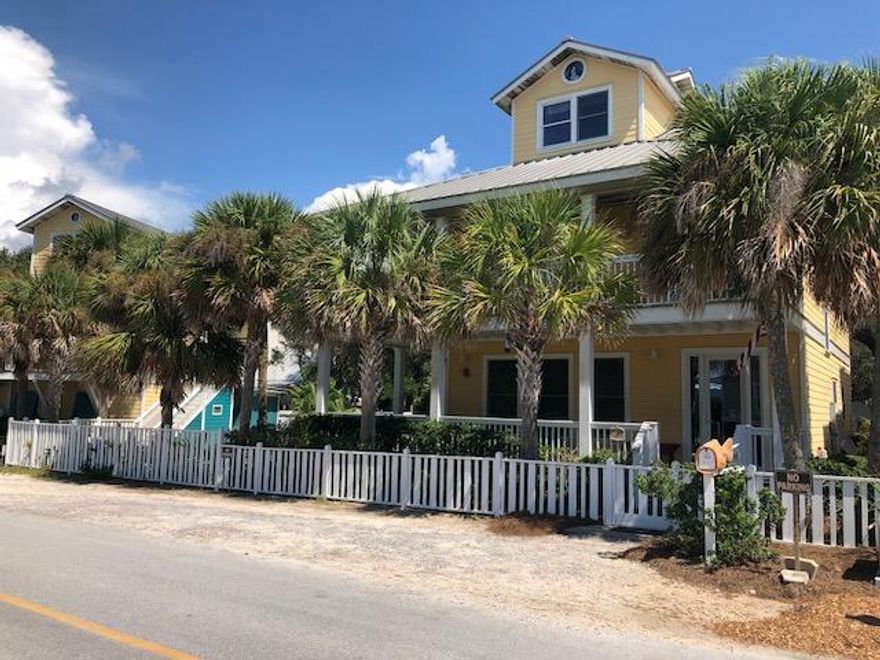 'MELLOW YELLOW' is an exclusive, one of a kind offering in Grayton Beach. Unique lot shape and dimensions allowed for custom-built, classic Florida Cottage main house with spacious courtyard/gas heated salt water pool/patio area and a carriage house. Located the lower traffic, most desirable Magnolia Street in New Grayton. Carriage house includes a spacious 2 car garage with 1/2 BA and additional storage, convenient outdoor shower and outdoor kitchen area'cook house' . Thoughtfully designed for enjoyment and entertaining on the sprawling pool deck and surrounding patio area, covered porches of main house. Colorful, well appointed 1 BR 1.5 BA, 864 sq' interior of Carriage house features open living/kitchen/ dining area for extended family and guests. Main house is comprised of 2,605 sq