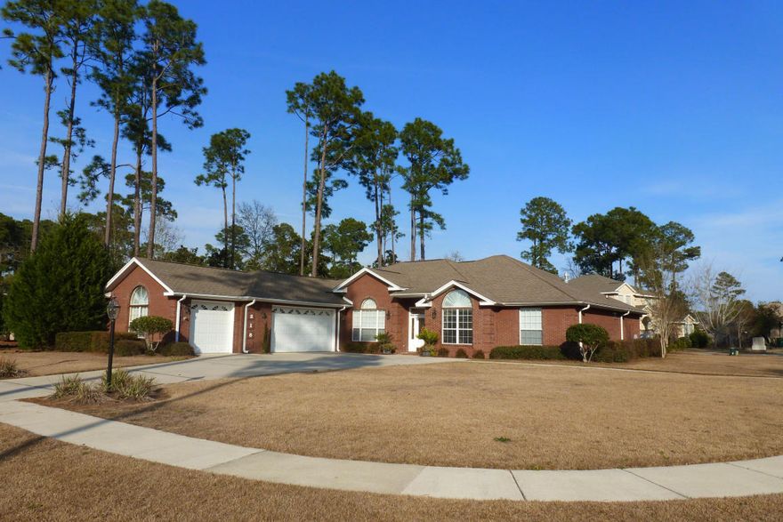 Welcome home! This custom built, all brick beauty is nestled on a corner lot in the highly desired neighborhood of Bayshore Place. Step inside to be greeted with gorgeous, flowing hardwood floors, raised ceilings, textured walls with bullnose corners, recessed lighting and crown molding throughout. Spacious family room featuring a brick gas fireplace with built in shelves on each side. Kitchen is a chef's dream sporting granite countertops, island with built in gas cooktop and vegetable sink, built in microwave and convection oven, and tons of cabinets featuring above and under cabinet lighting. Over-sized walk in pantry provides additional storage. Large eat in area in addition to formal dining room, both with tray ceilings. Over-sized master bedroom with private entry to