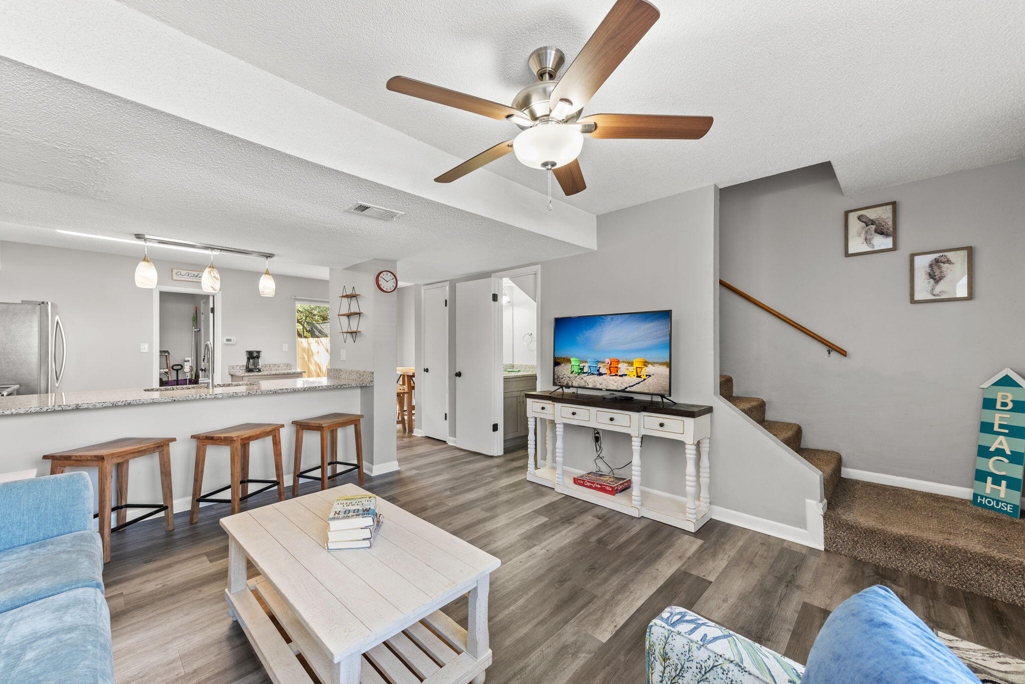 Fully furnished and ready for move in or to be your next investment property. This 2 bedroom, 1.5 bathroom townhome is equipped with a kitchen that has granite countertops, soft close drawers, and plenty of cabinet space. The large lsaundry room is right off of the kitchen. The livingroom features luxury vinyl floor planking, a bench window seat, and open concept with the half bath easily accessible. Upstairs the primary bedroom is located on the right side of the bathroom overlooking the backyard. The second bedroom has a large window overseeing the driveway. The back yard is accessed through the sliding glass door in the kitchen and features a separate entrance through the fully fenced backyard. Located between both bases and 15 minute drive to the beach. This townhome is ready