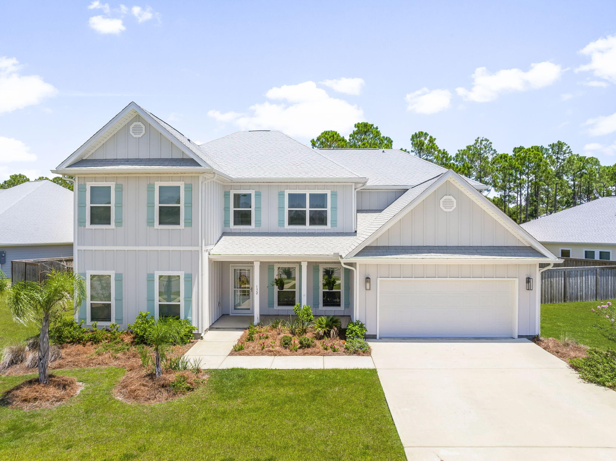 Welcome to 132 Tierra Verde Way in Panama City Beach, a stunning two-story home offering a thoughtful layout, upgraded finishes, and a prime location in the desirable Tierra Verde community. Situated on an oversized lot on a quiet dead-end street, this property provides additional privacy while still being minutes from some of the area's most popular attractions. The south-facing front porch offers tranquil lake views, where you can often enjoy sightings of native birds, turtles, and fish. This lakefront setting brings a sense of nature and peace right to your doorstep while still having access via golf cart to shopping, dining, and entertainment.
