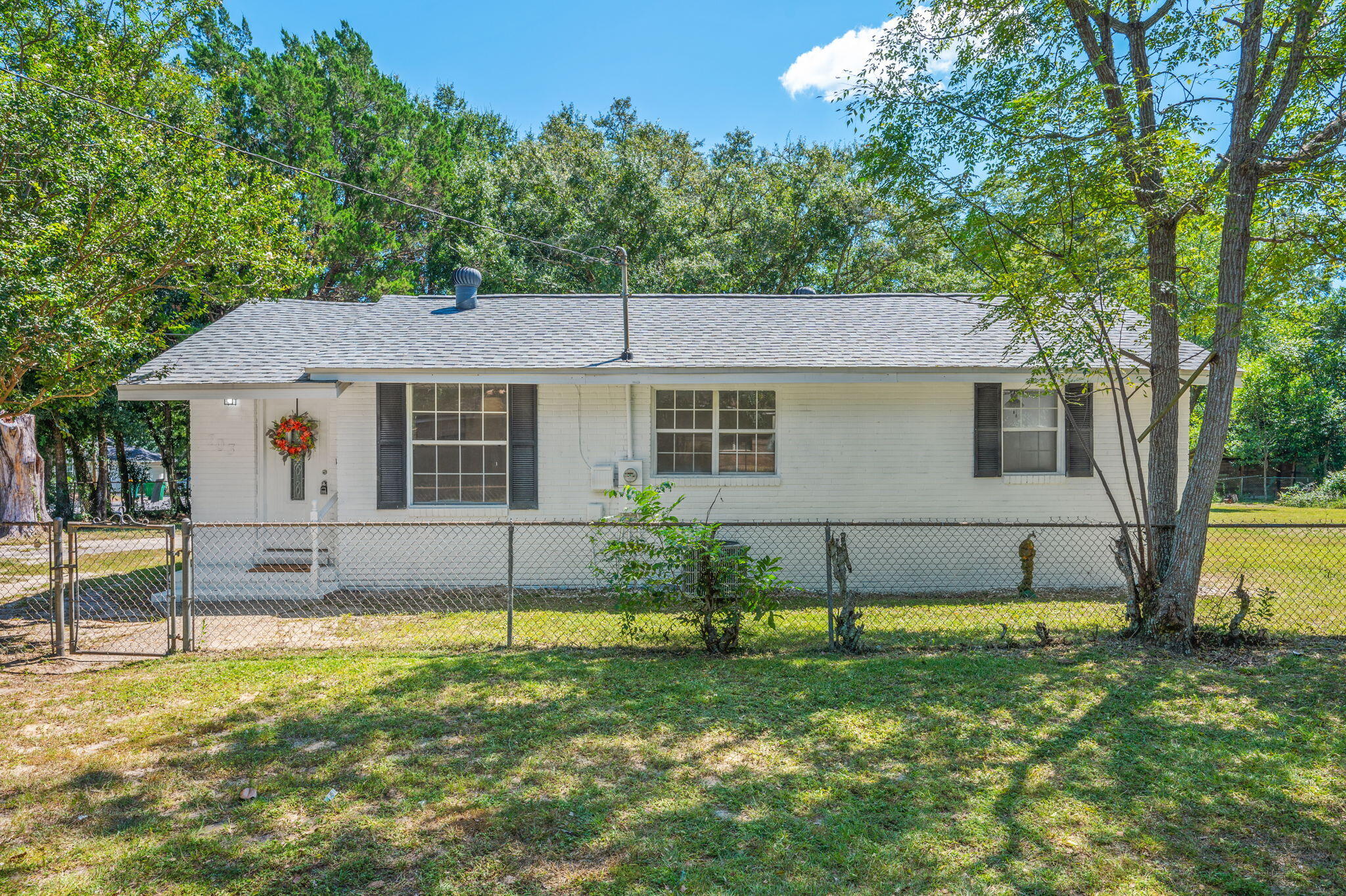 Check out this 1952 brick home in Southeast Crestview with 1,121 sq ft, 3 bedrooms, and 1 bath featuring a custom tile shower. A versatile flex room adds space for an extra bedroom, office, or home gym. Major updates include a 2023 roof, 2025 HVAC, and freshly painted exterior. Outside you'll find a 16x8 storage building, partially fenced yard, and low-maintenance space to enjoy. Perfect starter home or rental investment opportunity with character and some updates already in place!