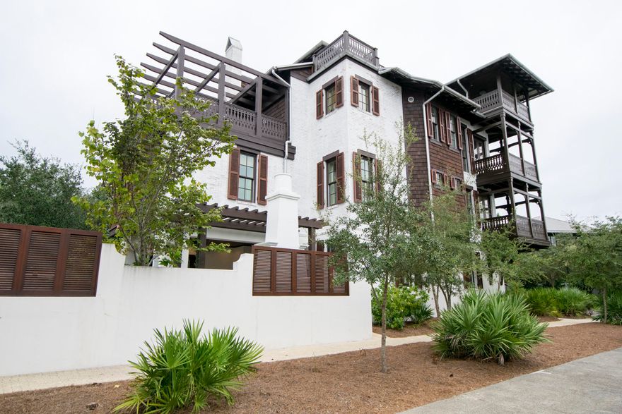 Entering through the front door into the foyer has ebony hardwoods meeting crisp white walls and a hand-forged wrought iron staircase. This is 25 Johnstown Lane  a 4 bedroom, 5.5 bath main house and 1 bedroom, 1 bath carriage house complete with two car garage. The property's antique white painted brick exteriors stand out as the end cap to Rosemary Beach's five townhouse properties. Located on the quiet northern end of the Rosemary Beach community, a short stroll to the new Owners Club and Pool at the St. Augustine Green there's no better place to call home.The first level guest room and en suite bath set the tone of a residence with exquisite furnishings. Custom finishes abound in all areas of the property with unparalleled attention to detail and design. its a must see property