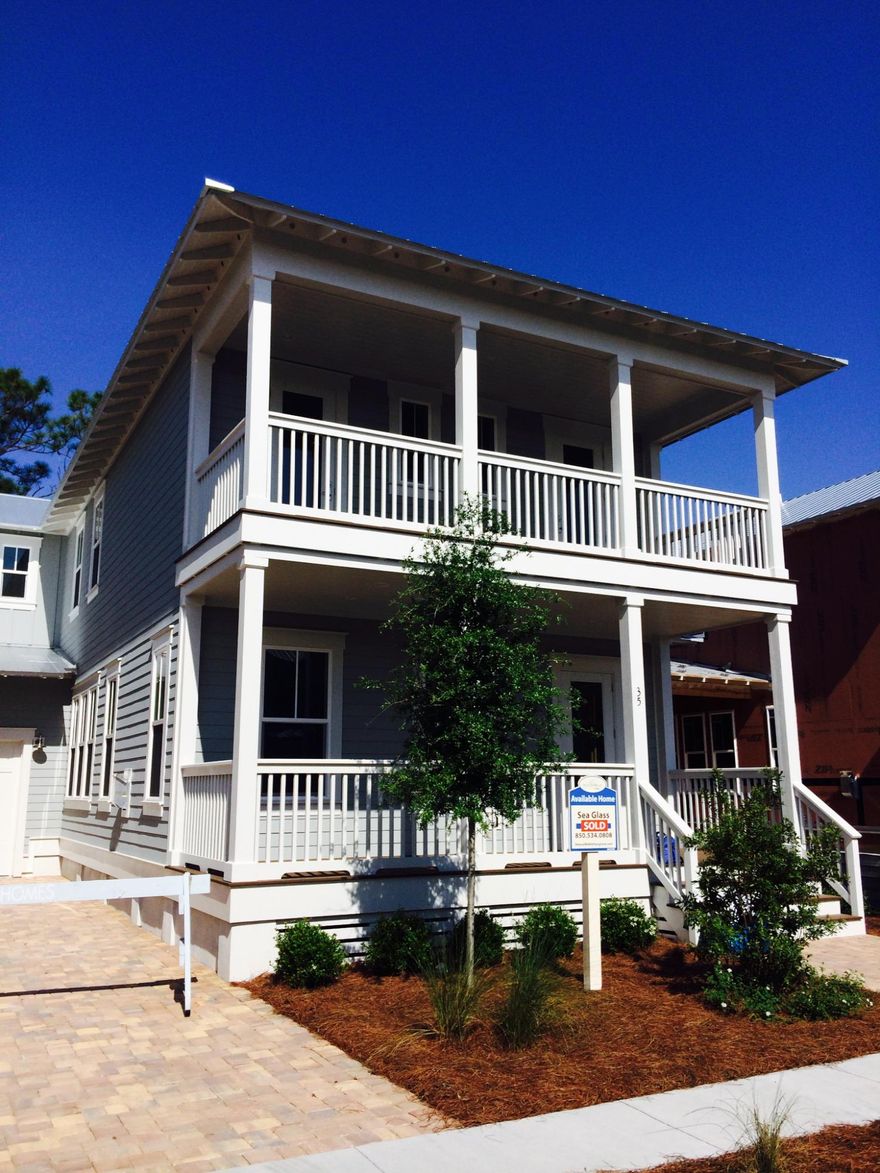 Sea Glass in NatureWalk and it is move in ready! 4 bedrooms, 3.5 baths, garage, and plenty of covered porches. Very open 1st floor and large kitchen is perfect for entertaining. Kitchen features include glazed white cabinets, light granite countertops, huge island with bookshelf and wine rack, subway tile backsplash and GE Caf Appliance package including built in microwave and oven and GE Monogram chimney style hood vented to the exterior.