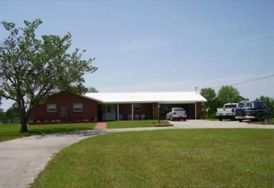 UPDATED 3 BDRM BRICK RANCH ON 3rd hole- 4th fairway of DOGWOOD LAKES GOLF COURSE... 7 miles north of Bonifay, FL off Hwy 177-A. On double lots, almost 2 acres. This all electric Home has been completely updated since 2006. LAST APPRAISAL gave the house a 2005 ''Effective Build'' upgrade. Nice upgrades. Energy-Efficient appliances, 3-1/2 Ton 15 SEER H/C unit, and H/W Heater. Very reasonable electric bills to cool 1,560 sq.ft. heated/cooled living space, all ceramic tiled floors. Crown mouldings, granite counters & marble backsplash kitchen. Remodeled bathrooms with grab bars. Attached garage has laundry and workbench areas, plus storage shelving and cabinet. 2nd lot has 1-car sized brick shed for golf cart and riding lawn mower. HOME WARRANTY WILL BE PROVIDED.