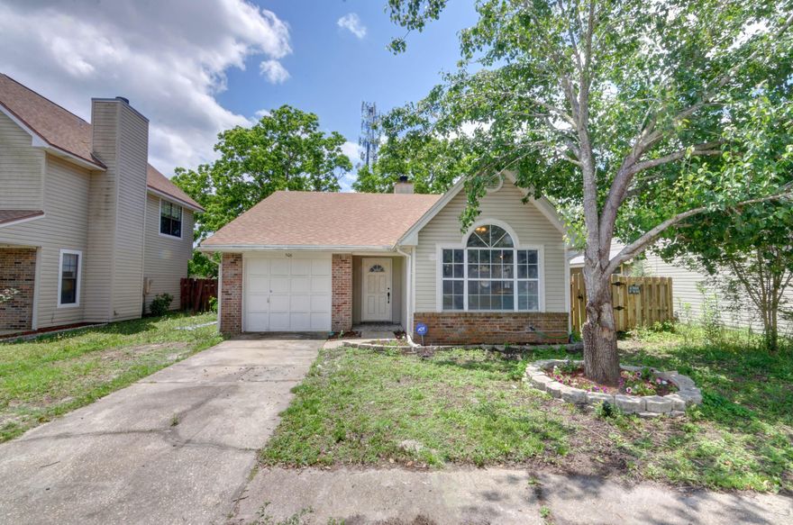 LOCATION LOCATION LOCATION! Only one mile from the front gate of Hurlburt Field this adorable home is located in the convenient Woodland Park Estates subdivision and even has direct access to a park! Clad in wood and vinyl siding with a roof installed in 2015 and an HVAC system less than two years old. You'll love the luxury vinyl plank flooring installed throughout the living room, hallway, and kitchen. The living room features a soaring raised ceiling and a wood burning fireplace, as well as sliding glass doors to the side patio (the master bedroom also has backyard access). The kitchen is adorned with windows on one side for great natural lighting at the eat in kitchen space, and it has granite countertops and stainless steel appliances. The three bedrooms have carpet, and both tile