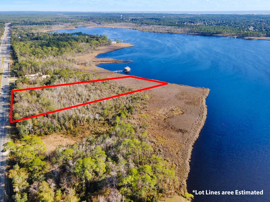 Make these 8 acres of wooded, waterfront property along Hwy 87 in Navarre yours today! Located just minutes from Navarre Beach, and a short drive to I-10 for easy commuting to all surrounding areas and military bases. With no HOA and public water and utility access available out front for you to get connected to and build your waterfront getaway, your own private fishing hole, or just your very own spot to catch the sunsets on the bay!