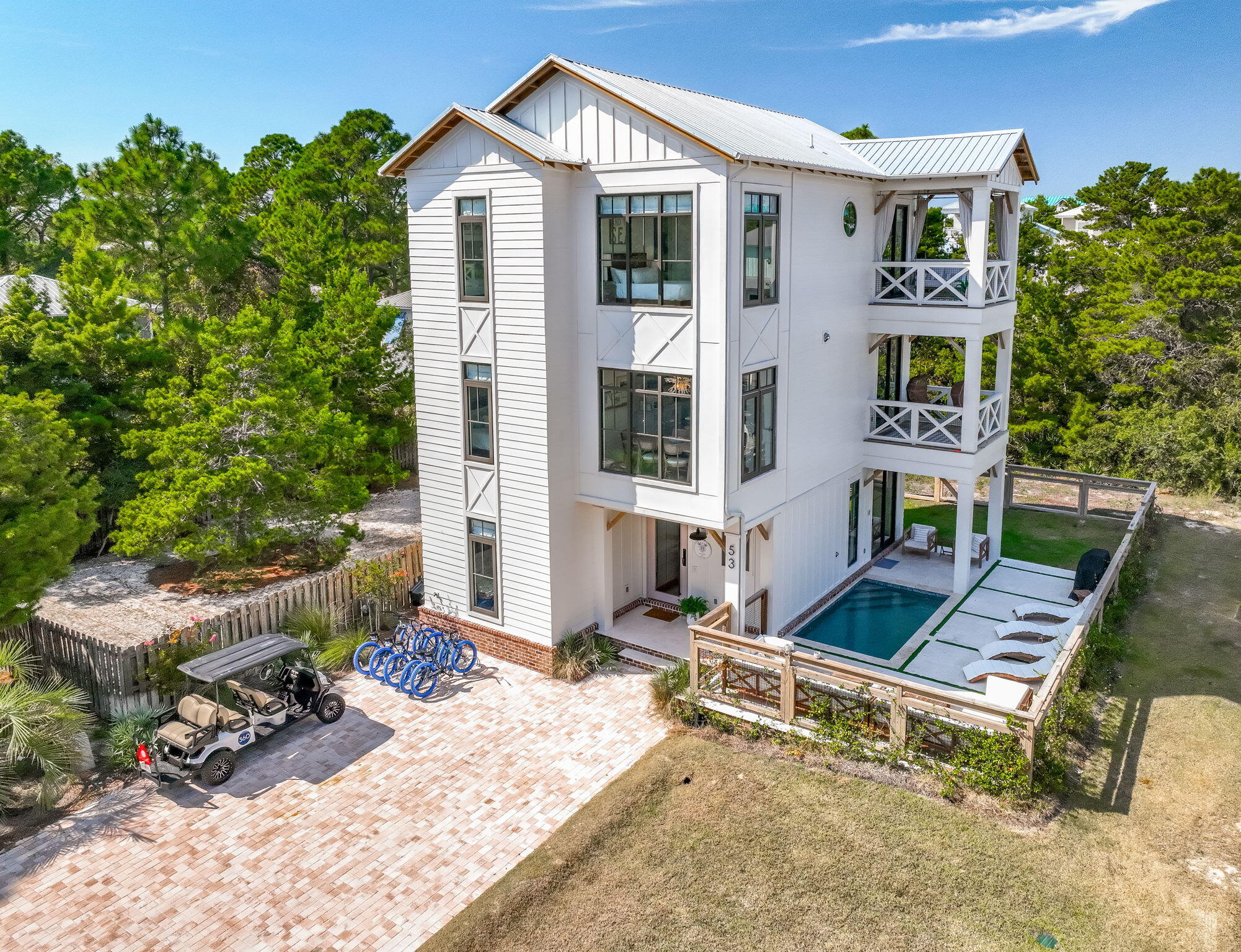 Nestled in the prestigious enclave of Blue Mountain Beach along the iconic 30A, 53 Porpoise Street is a recently constructed (2023) masterpiece of coastal elegance. This beachside haven offers the pinnacle of seaside living with a private pool, designer furnishings, and an enviable location just minutes from the sugar-white sands and turquoise waters of the Gulf. Step inside and discover interiors that blend elegance and comfort with ease. From the open living spaces to the beautifully appointed bedrooms, every detail has been thoughtfully curated with high-end finishes and carefully chosen furnishings that capture the spirit of coastal living. This is a home designed not just to be lived in, but to be savored. Your private outdoor oasis awaits. Lounge in the sun by the sparkling pool, share alfresco dinners in the courtyard, or host unforgettable gatherings under the stars. Whether you're taking a refreshing morning swim or enjoying a tranquil evening soak, the poolside retreat promises endless opportunities for relaxation and celebration.
Beyond your doorstep, the best of 30A living surrounds you. Explore charming boutiques, bike along scenic coastal paths, indulge in world-class dining, or set out on endless adventures beachcombing, paddleboarding, kayaking, and more. Blue Mountain Beach is a vibrant mix of natural beauty and coastal culture, and this home places you at the heart of it all. Restaurants and bars in Blue Mountain Beach include Red Fish Taco, Cowgirl Kitchen Market & Cafe, Basmati's Asian Grill, Blue Mountain Bakery, The Perfect Pig, For The Health Of It, and Blue Mountain Creamery for ice cream. Other nearby options include M&P, Mimmo's, and Stinky's. This is more than a beach house; it's a lifestyle. With its prime location, captivating design, and private pool, 53 Porpoise Street offers a rare opportunity to own a brand-new residence in one of the most sought-after communities on Florida's Emerald Coast. Call your agent to arrange your private tour today and experience the essence of coastal luxury.