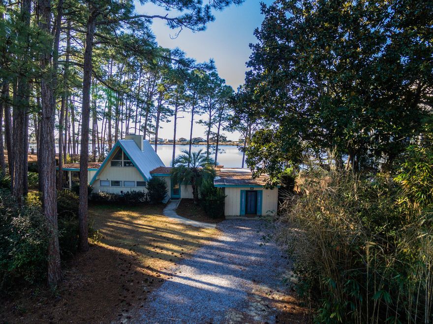 Adorable, recently renovated, Florida Beach cottage perched on Oyster Lake overlooking 30A, within a short 3 min golf cart ride or 7 min walk to Florida's most beautiful beach, The Emerald Coast! This A Framed home is a perfect turn key investment property that sleeps 10, featuring 3 bedrooms, two of which open to the back yard and pool with lake views, PLUS a loft Bedroom with two beds, 2 full baths, open living/dining/kitchen area with vaulted ceiling & floor to ceiling windows and gorgeous lake views that open to the pool area, a large 21x15 screened in porch, brand new heated pool and hot tub with grilling area, a large lot with a big back yard fronting Oyster Lake with it's own private dock for fishing or kayaking and paddle boarding. Fully renovated recently, new features include