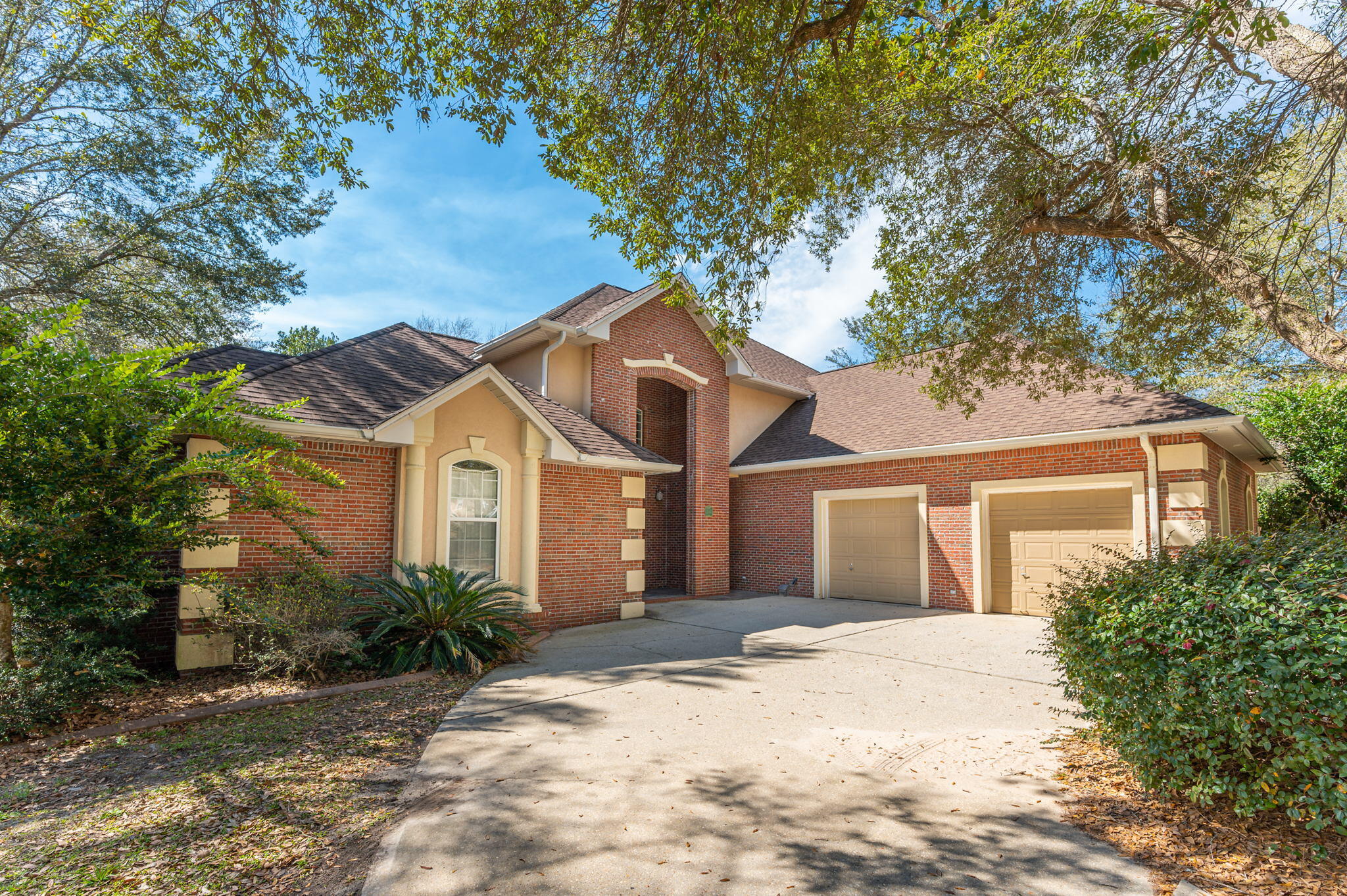 Remarkable home with 4 bedrooms plus a possible 5th. On the main level there are two master bedrooms, Salt water, gunite pool backed up the woods, all brick exterior, 21 foot ceiling in living room & 10 ft. textured ceilings through main floor, central vacuum system, sunny family room overlooking the pool area, 2 newer HVAC system and many custom features and built-ins. The main Master bedroom is large, has double walk-in closets, double vanities, a whirlpool tub and tiled shower. It features a lighted trayed ceiling as well.  The 2nd bedroom on main level has it's own full, bathroom and walk-in closet. Upstairs there are 2 bedroom plus a den/media  area.  (this could be a great 5th bedroom, if needed.) The 2 bedrooms have a very nice ''Jack & Jill'' bathroom with walk in closets. Large Lot!