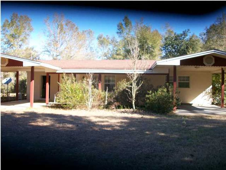 One of the best built homes in the area. Block exterior with tile floors though-out. Remodeled recently. 14 acres in a great location. Several out-buildings for storage and work-shop. Must see this home to appreciate. Home has up-graded security system