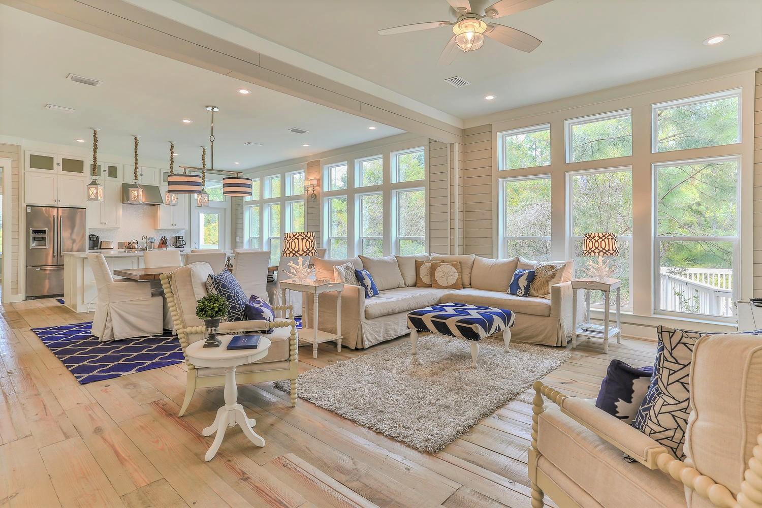 Welcome to Endless Serenity Cottage, the beach home you've been waiting for in Seacrest Beach. This highly desirable community is perfectly positioned between Rosemary Beach and Alys Beach making it an ideal location to walk or bike, and to explore all that 30A has to offer with shopping, dining, and entertainment right at your doorstep. Tucked away on a quiet cul-de-sac, this exceptionally built and beautifully maintained beach home's premier location sets it apart from the rest as it is nestled in privacy, surrounded by a wooded nature preserve, and sitting on a wooded nature trail. The home offers a bricked driveway that can easily accommodate 2 cars, along with an attached 2 car garage with a ping pong table, extra refrigerator / freezer, and ample storage shelving. A delightful outdoor shower will be waiting for you on your return from the beach or pool. A welcoming and commanding pergola leads you to the front entry of this beautiful home. A gracious entry welcomes you into the home and peaceful, wooded privacy is immediately discovered. An endless wall of floor to ceiling windows, the entire length of the living area, creates a backdrop that draws you in, offering endless privacy and wooded preserve views, and brings beautiful natural light into the home. Throughout the home, a perfect coastal design is highlighted with rustic, solid pine flooring along with shiplap covered walls. Professionally decorated in laid-back coastal elegance, the home exudes rest and relaxation at the beach. With its open floor plan design, the living area on the main floor offers ample room to spread out for large family gatherings. The dining table, positioned to separate the kitchen and living area, easily accommodates eight. All the comforts of home are convenient and easily accessible, and will not be missed in this charming beach home.
The chef's kitchen, featuring Dacor and Bosch appliances, is large and open, providing an impressive kitchen island. There will always be enough room cooking and entertaining in this airy and bright kitchen with its oversized island with breakfast bar. The beautiful custom cabinetry is highlighted with white quartz countertops, farmhouse sink, and a hidden under cabinet microwave. The kitchen island also provides extra storage underneath the breakfast bar. This perfectly designed, open kitchen with wooded preserve views was made for entertaining and family gatherings. A perfectly placed walk-in pantry right off the kitchen, featuring custom wood shelving, provides ample storage. You will also find a generously sized half bath on the main floor that offers extra storage, a walk-in laundry room with built-in cabinetry and storage, and an extra closet for even more storage.
Directly off the kitchen and dining area you will find a shaded and private covered porch, offering views of the wooded preserve and the nature trail leading to Rosemary Beach. From the porch, take the stairs down to your outdoor dining and grill area right on the wooded preserve and nature trail. Here, you will also find an attached storage room, offering a generous amount of space to store all of your beach necessities.
The main floor of the home conveniently offers a generous Master Suite with an en suite bath that provides a walk-in shower, double vanity sinks, custom cabinetry, and linen closet with ample storage. This main floor Master Suite is surrounded in windows and overlooks the wooded preserve, offering you complete privacy. Currently, this bedroom is furnished with 2 queen beds, but can easily accommodate a king bed.
A beautiful, light filled staircase leads you to the second floor, where you will find the children's den or a second living space for your guests. The bunk room, perfectly located off the second living space, offers a walk-in closet, large window with wooded view, and separate lighting in each of the two bunks along with a pull-out trundle bed. A half bath is conveniently located off the second living space and bunk room. On the second floor you will also find a large guest bedroom filled with light from oversized windows, while also providing complete privacy. This guest bedroom offers a walk-in closet, along with an en suite bath with double vanity sinks, and shower with tub. This guest bedroom is currently furnished with a queen bed, and is large enough to easily accommodate a king.
A second Master Suite with an en suite bathroom is located on the second floor. The en suite bath of the second floor Master Suite offers a walk-in shower, separate water closet, and custom cabinetry with tremendous storage. This Master Suite also offers two walk-in closets with custom wood shelving and generous storage. One walk-in closet is currently being used as an owner's closet. A wonderful covered porch awaits you through French doors off the Master Suite. The covered porch, gracious in size, offers wooded views, roof top views, and perfect privacy. Wake up with the sun and enjoy your morning coffee on the porch. Settle in one of the four rocking chairs and rock the world away with the sunset, or relax and read a book during a rain shower. The covered porch is perfect anytime of the day.
The community of Seacrest Beach offers wonderful amenities, including an impressive 12,000 sq. ft. lagoon style swimming pool, with swimming areas for any and all age groups. A new snack bar located at the pool for a convenient lunch, and most importantly, deeded beach access. A beach tram that will accommodate all your beach necessities will carry you to and from the beach. With a tram stop directly in front of the home, and tram stops throughout the neighborhood at almost every main stop sign, you will always get to and from your deeded beach with ease. The community also offers a wooded nature trail for you to walk or bike through a wooded nature preserve that acts as a greenspace surrounding the neighborhood. The nature trail leads to 30A when traveling West, and Rosemary Beach to the East. Endless Serenity Cottage is located directly on the nature trail and wooded nature preserve. This home is an established vacation rental, and would also make a perfect full-time residence, offering peaceful, wooded surroundings and privacy. This truly is a perfect home, in a perfect location, waiting for you in Seacrest Beach.