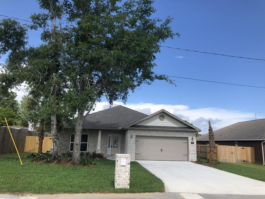 BEAUTIFUL CUSTOM ALL BRICK 4 BEDROOM 2 BATH HOME WITH 9 & 10 FOOT CEILINGS AND LOADED WITH AMENITIES. You will love this Very Open floor plan with a large Family room with reverse tray ceiling and rope lighting which gives a very elegant look in the evenings. If you like entertaining then this floor plan is for you!! The kitchen boast granite countertops with breakfast bar with a USB outlet and built in table bar for 6, custom cabinets with soft close drawers, a pantry, upgraded stainless steel appliances including a refrigerator with ice maker. Upgraded lighting fixtures and mirrors throughout the home along with crown molding in many areas of the home. The master bath you will love with his and her vanities and enjoy the separate garden tub for relaxing baths.