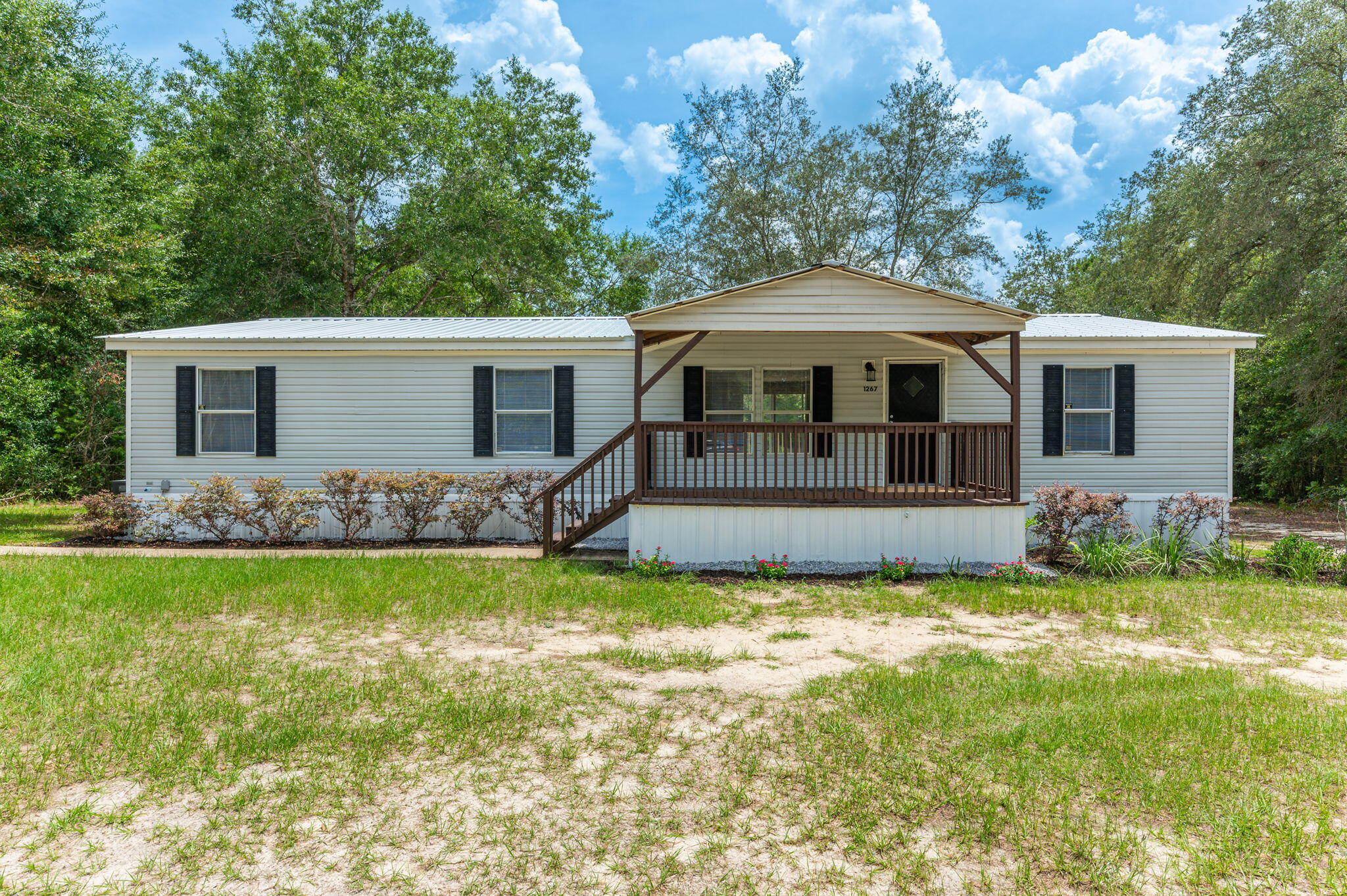 Escape to your own private slice of paradise. This beautifully maintained manufactured home sits on 1.5 acres of waterfront with breathtaking views and room to breathe. Tucked away down a private drive, this property offers the peace and privacy you've been searching for. The home features a new roof, a spacious layout, and plenty of natural light. Step outside and take in the serene waterfront view --perfect for morning coffee or evening sunsets. Need space to create or store? You'll love the finished workshop with power, ideal for hobbies, a home business, or extra storage. This is the kind of property that rarely comes available--where the water is your backdrop, and the possibilities are endless. Schedule your private tour today and see why this one is truly special.