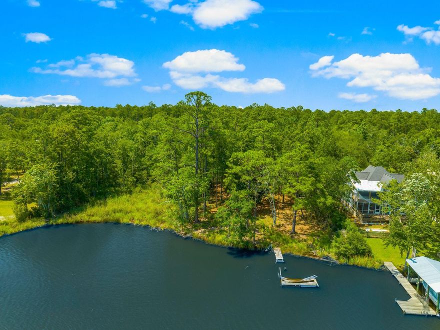 Nestled along the pristine shores of Freeport, this captivating bayfront lot beckons with the allure of a boater's paradise, offering an idyllic retreat amidst the tranquil waters of Choctawhatchee Bay. Situated on a secluded, no HOA street, this haven exudes exclusivity and serenity, promising privacy and seclusion of bayfront living without sacrificing convenience. Whether it's a waterfront estate with sweeping views of the bay, or crafting a cozy coastal retreat, the potential of this lot is as vast as the horizon stretching before it. For the individual seeking a harmonious blend of privacy, tranquility, and untapped potential, this bayfront lot in Freeport stands as a testament to the beauty of coastal living and the promise of a life well-lived amidst the timeless allure of the sea.