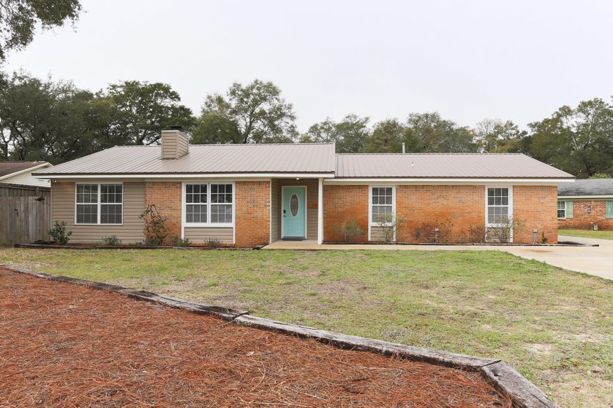 Move-in Ready! Beautiful 4 bedroom 2 bath remodeled home is in the heart of Niceville on a quiet cul-de-sac. Formal living room with wood burning fireplace, additional den/playroom, large eat-in kitchen, a separate dining room and large pantry/laundry room. Fourth bedroom has built-in queen murphy bed and floor to ceiling bookshelves. 600+ sq ft covered patio is an entertaining dream while the 2 car garage/shop (20X24) offers additional storage with an oversized front to back driveway. Property has been updated with new AC, duct system, new metal roof, new water heater, new vinyl siding, facia, soffits, new wood grain tile flooring throughout, and updated lighting as well as amazing custom built-ins. Includes large backyard with swing-set and separate fenced-in dog run.