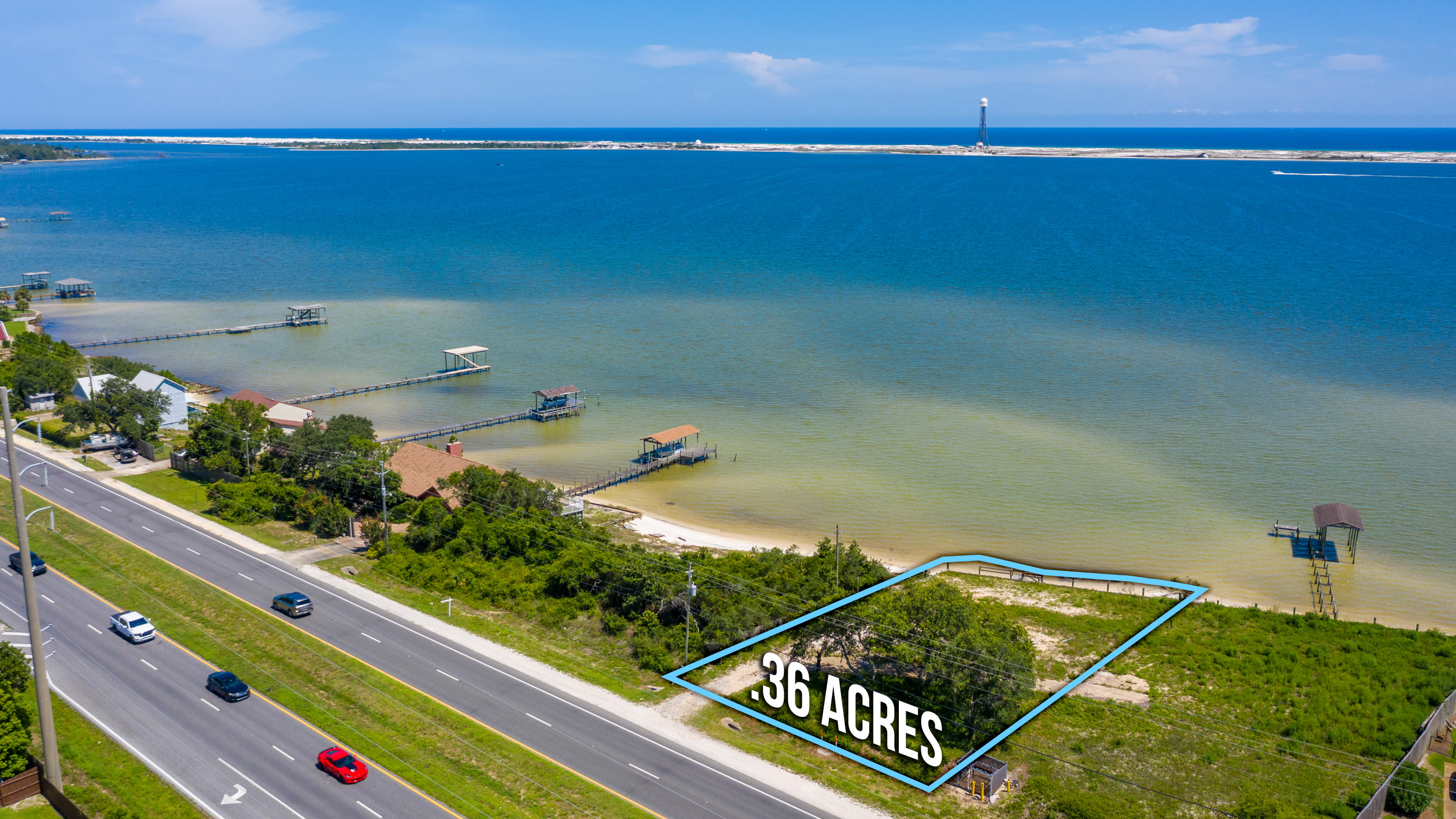 Beautiful waterfront lot on the sound with a spectacular views. This listing is for Parcel A. A newer double retaining wall has been built in the last few years. There are also stairs up from your private beach to the main property. Flood Zone X for the building area. You can build on pilings or a slab. This very high and dry property does not need additional height unless you want more of a view or more house. This property has gorgeous views and a lovely beach - 15 ft. + depending on the tide. You can add a pier for fishing or docking your boat. Water depth is 3 to 4 ft. deep at mid tide(summer) with a close-up dock and even deeper the further out you go. You have plenty of room for a swimming pool too. WILL ALSO BUILD TO SUIT - Nielsen ConstructionAerial video:https://vimeo.com/184