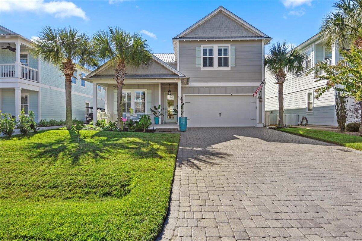 This exquisite Florida beach home is perfectly situated less than 1/2 Mile to the gated beach access.  Enjoy endless summers outside on the private fenced courtyard featuring lush landscaping and a custom screened lanai.  Inside, the open concept den and kitchen is suited for large gatherings with impressive soaring ceilings.  The Villas of Frangista is a gated neighborhood with a community pool and clubhouse.  A spacious two-car garage is perfect for your beach toys with built in cabinetry or could be converted easily for additional living space to maximize rental income.  The second floor holds 3 bedrooms two full bathrooms, and laundry.  This home has been meticulously maintained and has had only one owner and has never been rented.