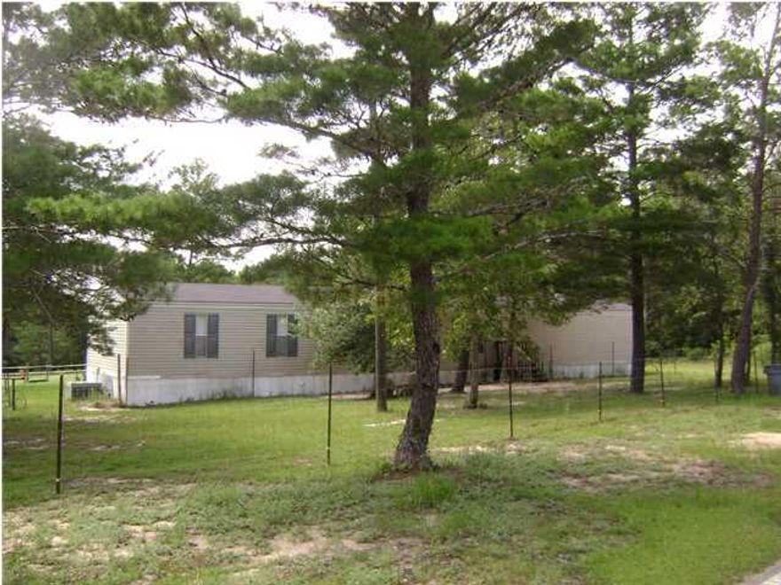 Located just North of Freeport, this is a good place to call home and enjoy the country setting! 3BR 2 BATH single wide mobile home on 4.58 acres. Open floor plan with spacious living room with vaulted ceiling, dining area with bar and extra cabinets plus stove and refrigerator included. Plenty of room in the master bedroom with walk in closet. Master bath has double vanity sinks with large garden tub plus separate shower. Back deck (12x14) has roof for afternoon comfort. The property is fenced with a barn (14x26) and pasture for horses. Front yard has also been fenced for pets. Call for an appointment to come see today!