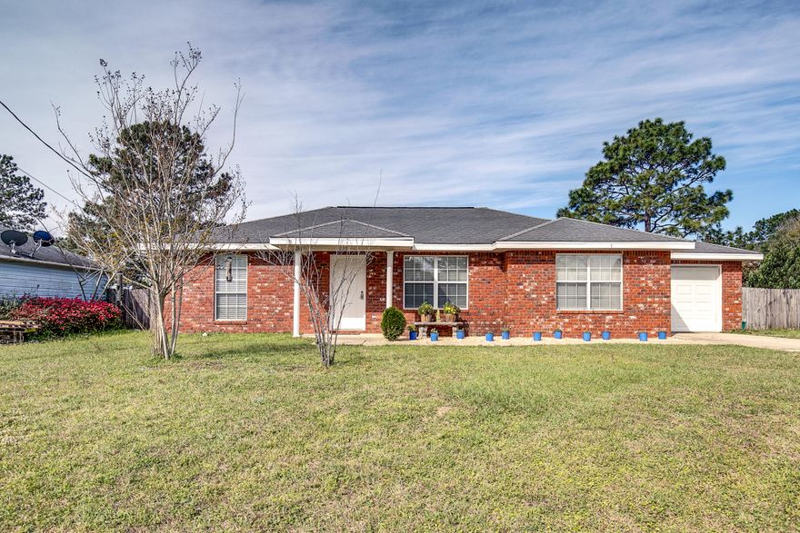 This adorable all brick home, located South of I-10 in Crestview is only $150k and move in ready. Close proximity to shopping, I-10 and more. As you enter you will notice the cathedral ceilings, tile floors throughout, a split bedroom floor plan and spacious kitchen with an abundance of cabinet and countertop space. Built in 2005 and offers a large flat yard, fully fenced and single car garage. The home has been freshly painted throughout and is ready for you to call it home. At this price point, this home will sell quickly, so call today to take a personal tour!