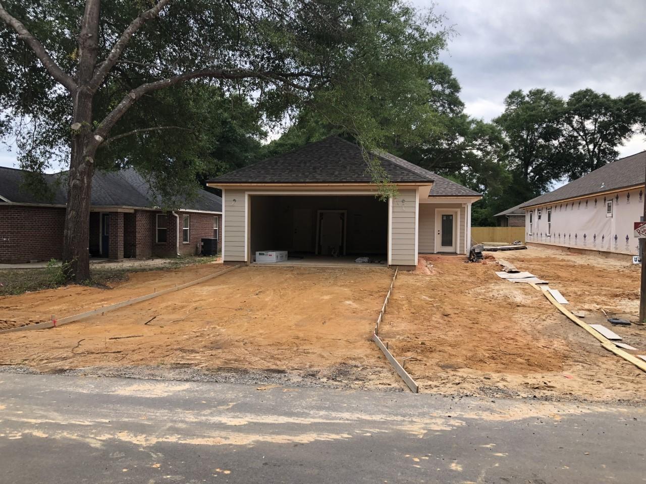 BEAUTIFUL HOME WITH MANY CUSTOM FEATURES. 3 BEDROOM 2 BATH HOME SITTING ON A LEVEL LOT. YOU WILL LOVER THIS VERY OPEN FLOOR PLAN WITH 9 FOOT CEILINGS AND TREY CEILING WITH CROWN MOLDING, THE KITCHEN WILL BOAST CUSTOM ALL WOOD CABINETS WITH SOFT SHUT DRAWERS, GRANITE COUNTER TOPS ALONG WITH UPGRADED FLOORING IN THE WET AREAS. WOOD LOOKING VINYL PLANK WILL BE PLACED IN THESE AREAS. RECESSED LIGHTING AND & ALSO GRANITE COUNTER TOPS, CUSTOM CABINETS WITH THE SOFT SHUT DRAWERS in bathrooms .CUSTOM TILE SHOWER WITH SEAT IN THE MASTER SHOWER WITH BENCH, RAINHEAD AND SEPARATE SHOWER SPRAYER. LARGE FAMILY ROOM THAT OPENS TO KITCHEN AND DINING ROOM. THIS HOME IS PERFECT FOR ENTERTAINING. THE KITCHEN HAS 3 LARGE PANTRIES AND A ISLAND BAR AS BIG AS A TABLE. STAINLESS APPLIANCES INCLUDING A