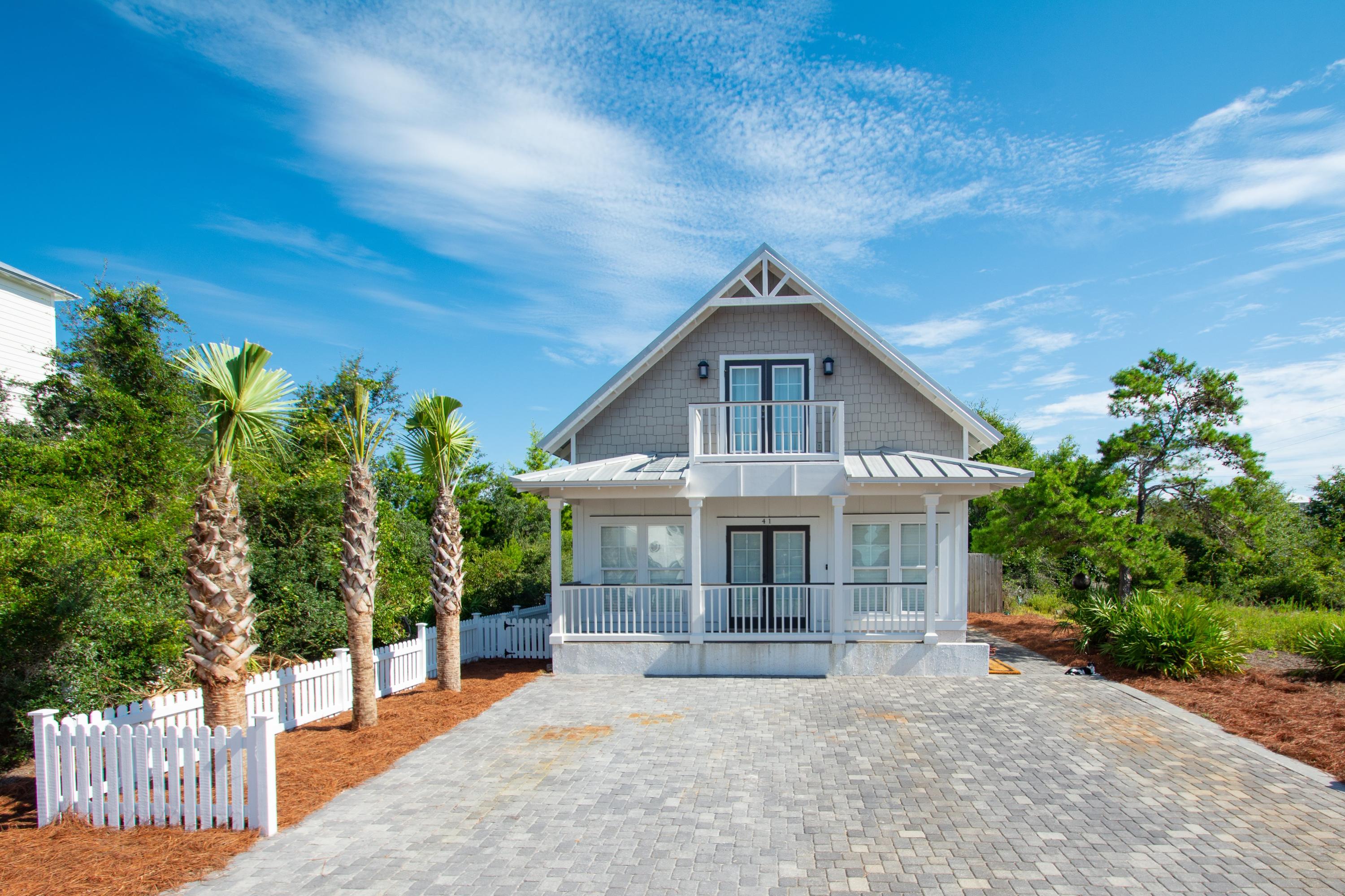 South of Highway 98, 1 block away from the beautiful beaches of the Gulf of Mexico. It is only 1/2 a mile away from Camp Helen State Park to the East and 1 mile to Rosemary Beach to the West. Lake Powell is right down the street, and it's only a 10 minute drive to the Pier Park Shopping center. Public beach access with no stairs and no worries about customary use. Beautiful 3 bedrooms, 2 1/2 bath home with hardwood floors, black absolute granite, custom cabinets, stainless steel appliances and a storage shed in the backyard. The island is a 5x9 piece of calacatta marble. Crown molding in living area. Newly painted exterior and interior. Closed cell spray foam insulation and tankless water heater. The perfect home for anyone looking to be close to the beach!!! Custom Golf cart included!!!