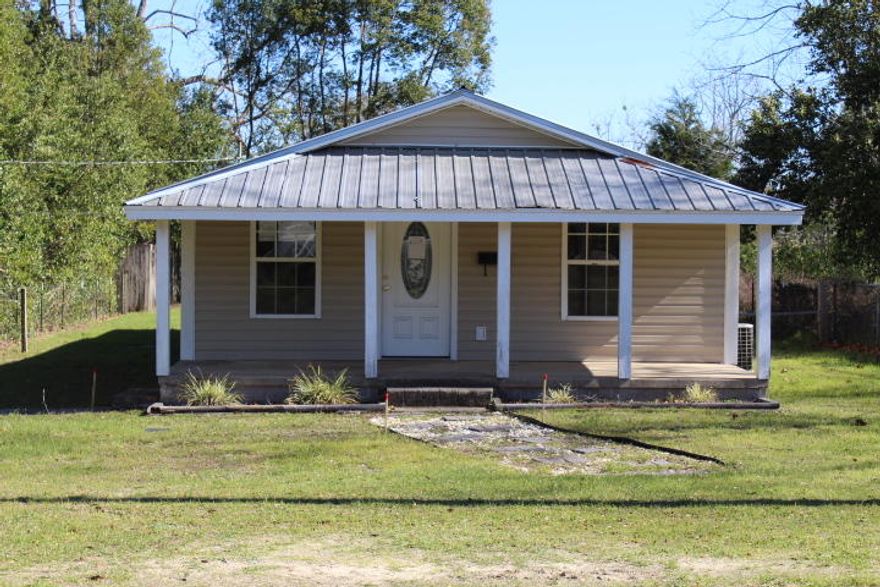 REO. Cute 3 bedroom, 2 bathroom cottage located in DeFuniak City limits. Home opens to an open living/kitchen combo with additional bedrooms just off the living room with a full bathroom between the 2. The utility room and master bed/bath are located in the rear of the home. Exterior there is a spacious screened porch and an open deck. This home would make a great starter home or rental! Call today to schedule your tour. Property sold ''as-is.''