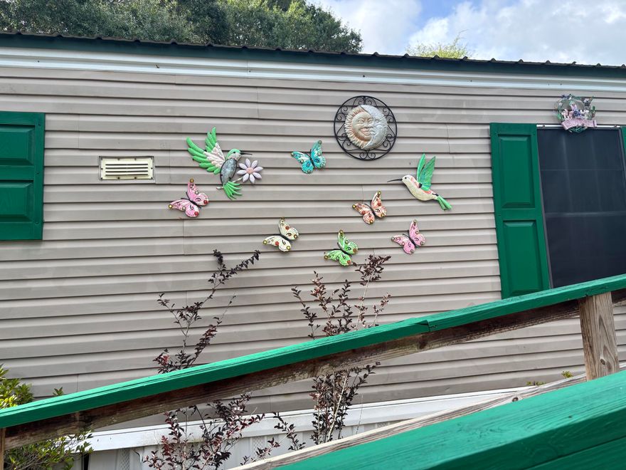 Welcome to this charming manufactured home situated on 2 spacious lots, totaling nearly 1/2 an acre. Enjoy peaceful mornings on the front porch or back deck, ideal for sipping coffee and taking in the surrounding nature. With a 16x16 building with metal roof can serve as a workshop or hobby space.The fully fenced yard offers privacy and flexibility whether you're considering adding a pool or creating a garden retreat. Large Concrete pad could be an RV spotInside, the home offers an excellent opportunity for customization. With a little TLC, this property has strong potential for use as a primary residence, seasonal getaway, or an addition to an investment portfolioConveniently located only approx. 50 min. To the beautiful South Walton Beaches, 20min to downtown Defuniak.