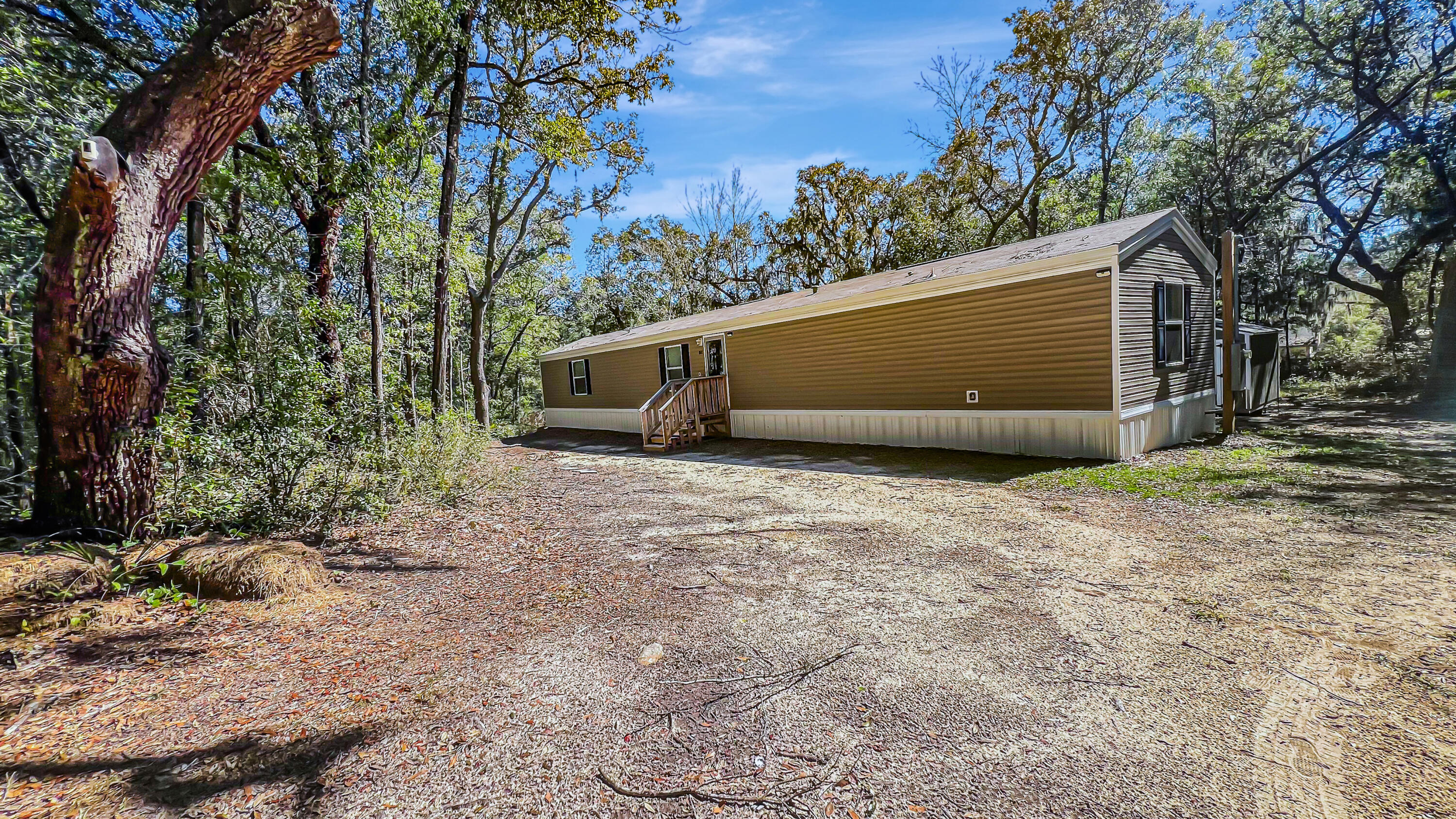 Welcome to your next home! This beautifully maintained, like-new manufactured home (built in 2022) sits on nearly a half-acre lot, offering the perfect balance of privacy and outdoor space. With 3 generously-sized bedrooms and 2 full bathrooms, this home features an open-concept floor plan that's ideal for both everyday living and entertaining guests.The home is filled with modern finishes, creating a bright and airy atmosphere throughout. From the stylish kitchen with contemporary appliances to the spacious living areas, every corner of this home is designed for comfort and functionality. It's truly move-in ready, offering the peace of mind that comes with a nearly new property, meticulously cared for. Situated just minutes from Navarre Beach, this home allows you to easily embrace the laid-back coastal lifestyle. Whether you're enjoying a day at the beach or dining at nearby local restaurants, you'll love the convenience of being so close to everything. Plus, with easy access to major highways and military bases, commuting and travel couldn't be simpler.
If you're looking for a home that combines modern living with space to breathe and is perfectly located near beaches and military hubs, this is the one for you. Don't miss your chance to own this well-kept, nearly-new manufactured home. Schedule a tour today!