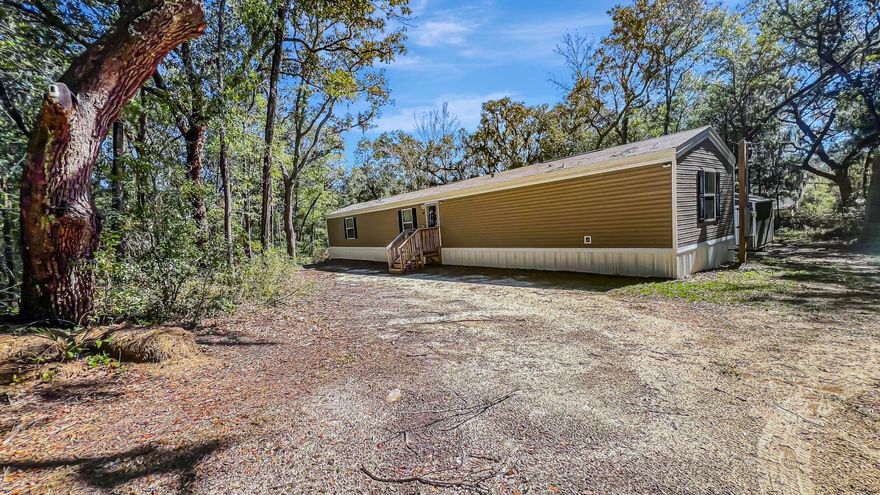 Welcome to your next home! This beautifully maintained, like-new manufactured home (built in 2022) sits on nearly a half-acre lot, offering the perfect balance of privacy and outdoor space. With 3 generously-sized bedrooms and 2 full bathrooms, this home features an open-concept floor plan that's ideal for both everyday living and entertaining guests.The home is filled with modern finishes, creating a bright and airy atmosphere throughout. From the stylish kitchen with contemporary appliances to the spacious living areas, every corner of this home is designed for comfort and functionality. It's truly move-in ready, offering the peace of mind that comes with a nearly new property, meticulously cared for. Situated just minutes from Navarre Beach, this home allows you to easily embrace the laid-back coastal lifestyle. Whether you're enjoying a day at the beach or dining at nearby local restaurants, you'll love the convenience of being so close to everything. Plus, with easy access to major highways and military bases, commuting and travel couldn't be simpler.

If you're looking for a home that combines modern living with space to breathe and is perfectly located near beaches and military hubs, this is the one for you. Don't miss your chance to own this well-kept, nearly-new manufactured home. Schedule a tour today!