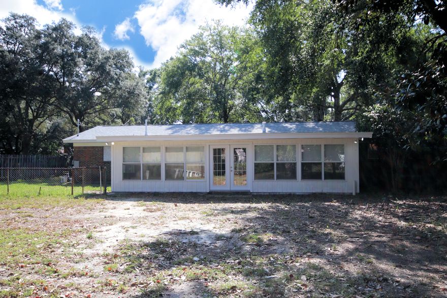 Looking for Space? This House Has It! All Brick Home Across from the Water! AND BRAND NEW ROOF! Enter into the Large Living Room with Picture Windows. This leads into the Big Spacious Kitchen with Tons of Counter Space and then to Dining Room. The Dining Room opens to the 35 x 18 Florida Room with enough space for a Pool Table, Big Sectional Sofa AND More. This room has a BRAND NEW Stand Alone Mini-Split HVAC System. New French Doors lead to Fenced Yard with 30 x 15 Workshop/Shed with Power. Yard still has Plenty of Room for a Pool. Oversized 2 Car Garage has a separate, enclosed Laundry Room with Loads of Storage Space! Addl Bedrooms are all good Sized. Nice Place to Call Home. Come See. You'll be Glad You Did :) Did I mention Waterfront Park around the corner?Buyer to verify measuremen