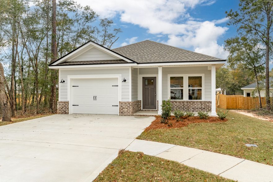 CORNER LOCATION FOR THIS NEW HOME featuring craftsman style touches inside and out.  Privacy fenced backyard with sprinkler system, fully landscaped.  Open family/dining/kitchen area with raised ceilings and recessed lighting.  Work island has bar seating, quartz or granite countertops, walk-in pantry, white shaker style cabinets.  Luxury vinyl plank flooring throughout, ceiling fans in all rooms, owner's bath has double vanities, tile walk-in shower, linen storage and walk-in closet.  Cozy rear porch for relaxing in the evening - July completion.  Photos of similar completed home, elevation, interior/exterior colors will vary.  Seller may pay up to $10,000 towards buyers closing costs and/or prepaids and/or rate buydown - restrictions apply call for details.