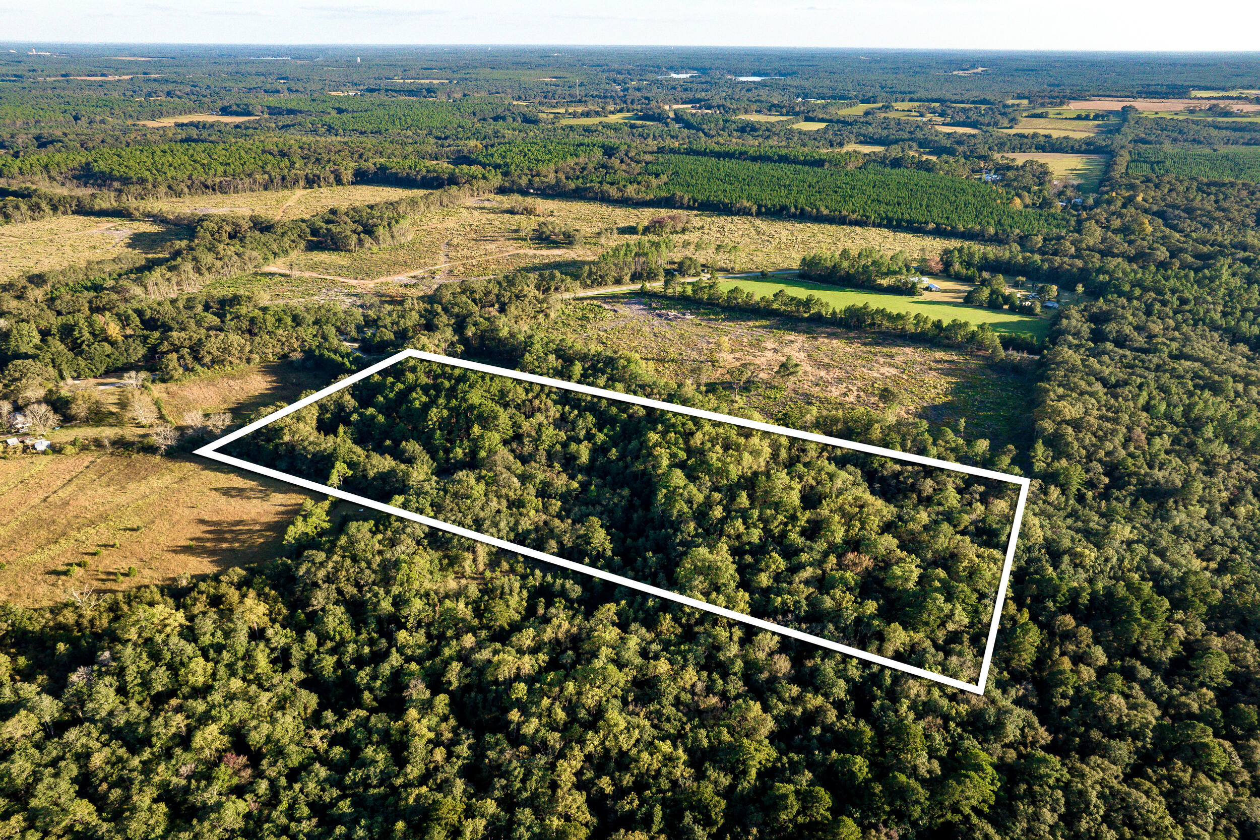 Introducing 10+ acres of prime land nestled  just north of Defuniak Springs on County Rd 1084.  Property has a 25' Easement off 1084 to the property.   Property is conveniently located an hour north of the beautiful Emerald Coast.  This property offers excellent hunting, an ideal destination for outdoor enthusiasts or permanent home. Includes approximately 7 acres of Timber and 3 acres of Hardwood.  Approximately half of the property lies in Flood Zone X and the other half in Zone A.