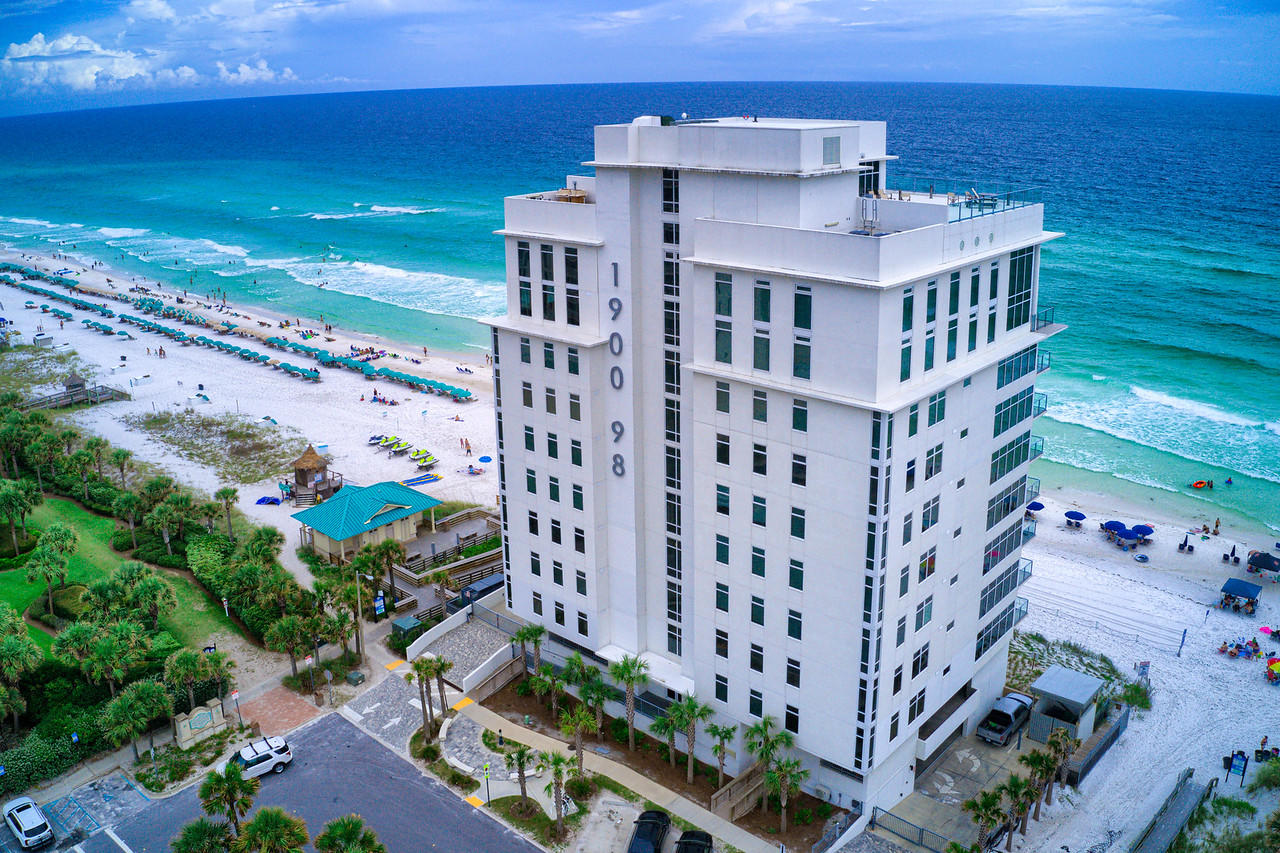 1900 Ninety Eight is Destin's newest luxury high-rise. Experience panoramic views of the Gulf of Mexico from this contemporary condo comprised of of only 16 private residences. Unit 602 faces the West with coastline views ranging for miles. The spacious & open floorplan allows for an abundance of natural light through the expansive wall of windows, all controlled by Lutron Electronics. Enjoy cooking on the Thermador kitchen appliances or the outdoor grill, while looking at the sparkling gulf waters. This condo also offers an extra office space/creative nook. Amenities include a rooftop pool, spa, fire pit and state of the art fitness center looking out over the gulf. Also gated entry with heated/cooled lobby area & two levels of parking beneath the residences