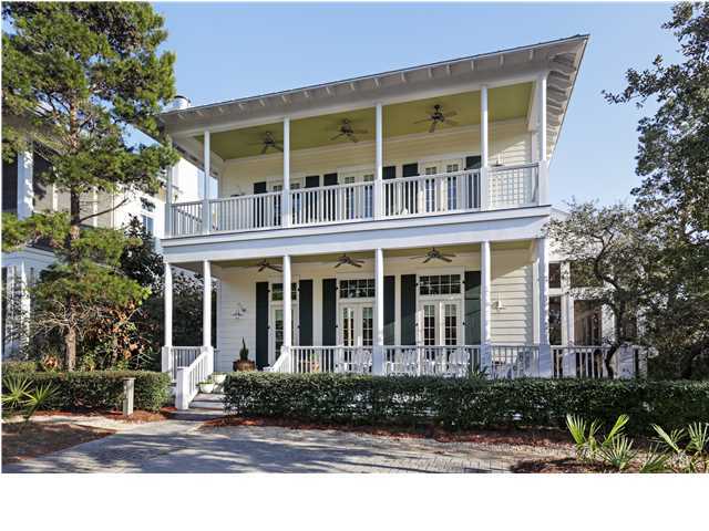 Welcome to 43 Sand Hill Circle - Watercolor's Phase III at its absolute finest. Directly across from the fun-filled community Frog Pool, this home features four bedrooms and three baths in the main house, with a carriage house above the garage featuring one bedroom, one bathroom, and a full kitchen. Entering the house you're immediately greeted by soaring 12ft ceilings and an expansive view of the kitchen, living, and dining area. A kitchen that is guaranteed to delight gourmet chefs and entertainers alike, soapstone counters atop both Wolf and Subzero appliances - to satisfy even the most discriminating taste. Upstairs, the spacious master and its en suite bath open onto a shaded porch overlooking Sand Hill Circle and the Frog Pool. Also upstairs, you will find a bunk room complete