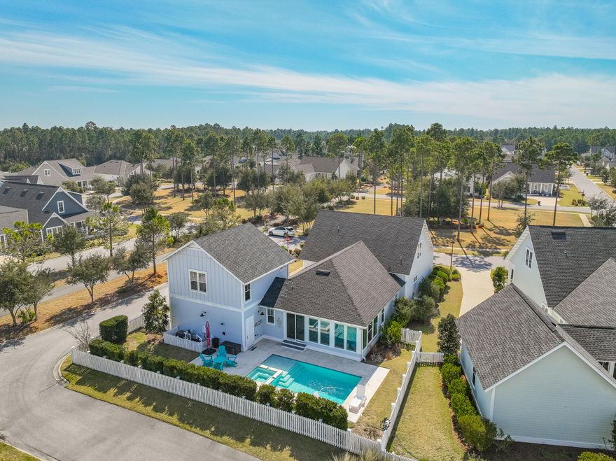 This exceptional five-bedroom, four-bath home offers 3732 square feet of thoughtfully designed living space, set on a quiet corner lot  across from a community park with serene views of the homeowners' pool and lake. Designed for both comfort and functionality, this home features three distinct living spaces, a newly enclosed back porch and custom-built shelving throughout multiple rooms.A recent addition above the garage provides a private fifth bedroom and an extra living area or home office accessible from inside the home. The kitchen is beautifully appointed with a built-in coffee bar, while upstairs, two bedrooms include heated and cooled storage for added convenience. Three HVAC systems ensure comfort year-round. With its spacious layout and multiple gathering areas, this home is an excellent choice for a full-time residence. Located in the sought-after Watersound Origins community, residents enjoy access to a nine-hole golf course, a resort-style pool, tennis and pickleball courts and scenic walking trails. Offering both elegance and practicality, this home is ideal for those seeking space, privacy and a vibrant coastal lifestyle.