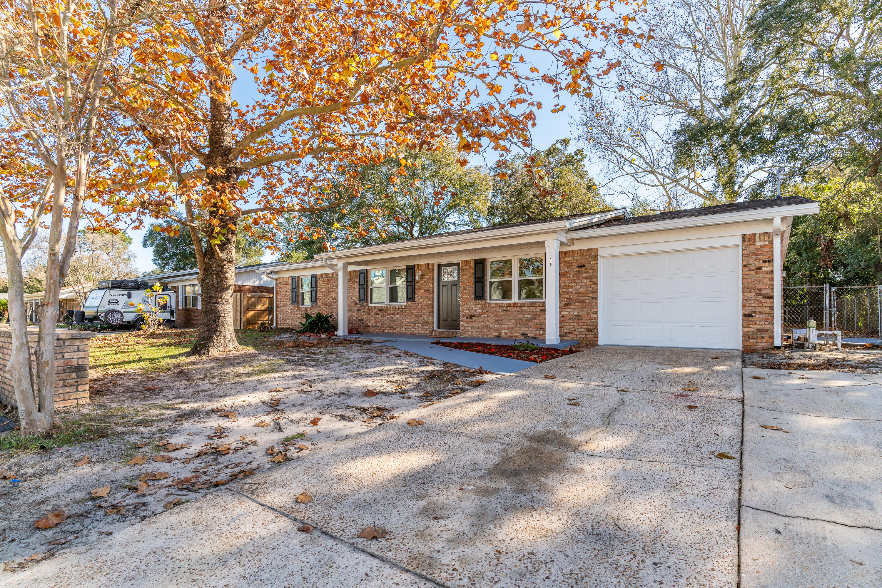 Welcome to 710 Mayflower Drive, a beautifully renovated home in the heart of Fort Walton Beach. This move-in ready gem boasts modern updates throughout, offering the perfect blend of style, functionality, and comfort.As you enter, you'll immediately notice the luxurious flooring that flows seamlessly throughout the home, complemented by custom cedar and accent walls that enhance the space with a touch of elegance and visual interest. The open, spacious kitchen has been thoughtfully designed with brand-new cabinets, sleek countertops, and top-of-the-line appliances, including a matching counter-depth microwave and oven by Frigidaire, a new refrigerator, and a GE built-in dishwasher. The master bedroom serves as a peaceful retreat, offering ample space and comfort. It is complemented by a fully renovated master bathroom featuring sleek floating vessel vanities, a smart LED de-fogging mirror, and contemporary finishes that create a spa-like atmosphere.

The home's additional bathroom is equally as impressive with it's modern design, while new LED lighting throughout ensures a bright, welcoming ambiance. Fresh paint and crown molding add a refined, elegant touch to every room.

The laundry area is both functional and convenient, featuring a new Maytag washer and dryer that will stay with the property. The garage has been freshly renovated to meet all your storage needs.

On the exterior, you'll appreciate the new roof, large screened-in back porch, and expanded double driveway with an additional parking space, perfect for guests or extra vehicles.

With its thoughtful updates and prime location, this home is move-in ready and waiting for you to enjoy. Don't miss the opportunity to make this beautiful property yours!