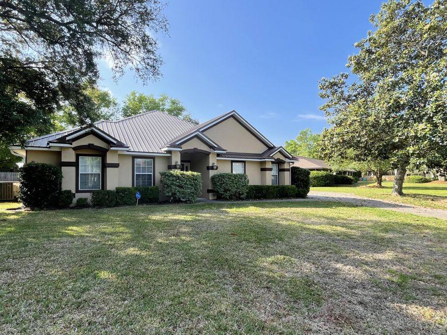Super rare 4 bedroom, 2.5 bath home in the most desirable neighborhood, in the most desirable school district in the state of Florida! As you approach this Mediterranean Style home you will notice the extra large expanded driveway leading to the two car garage on the side of home. This lovely home has been updated to include energy efficient hot water heater, air conditioner, and foam insulation, as well as ceramic tile throughout with attention to detail. House features split bedroom floor plan and high ceilings. Bose 7.1 surround sound system already in place. All updated lighting fixtures and ceiling fans throughout. Crown molding and built in plant shelves. In the kitchen you will find high-end stainless steel appliances surrounded by pecan cabinets for that nice added touch. .