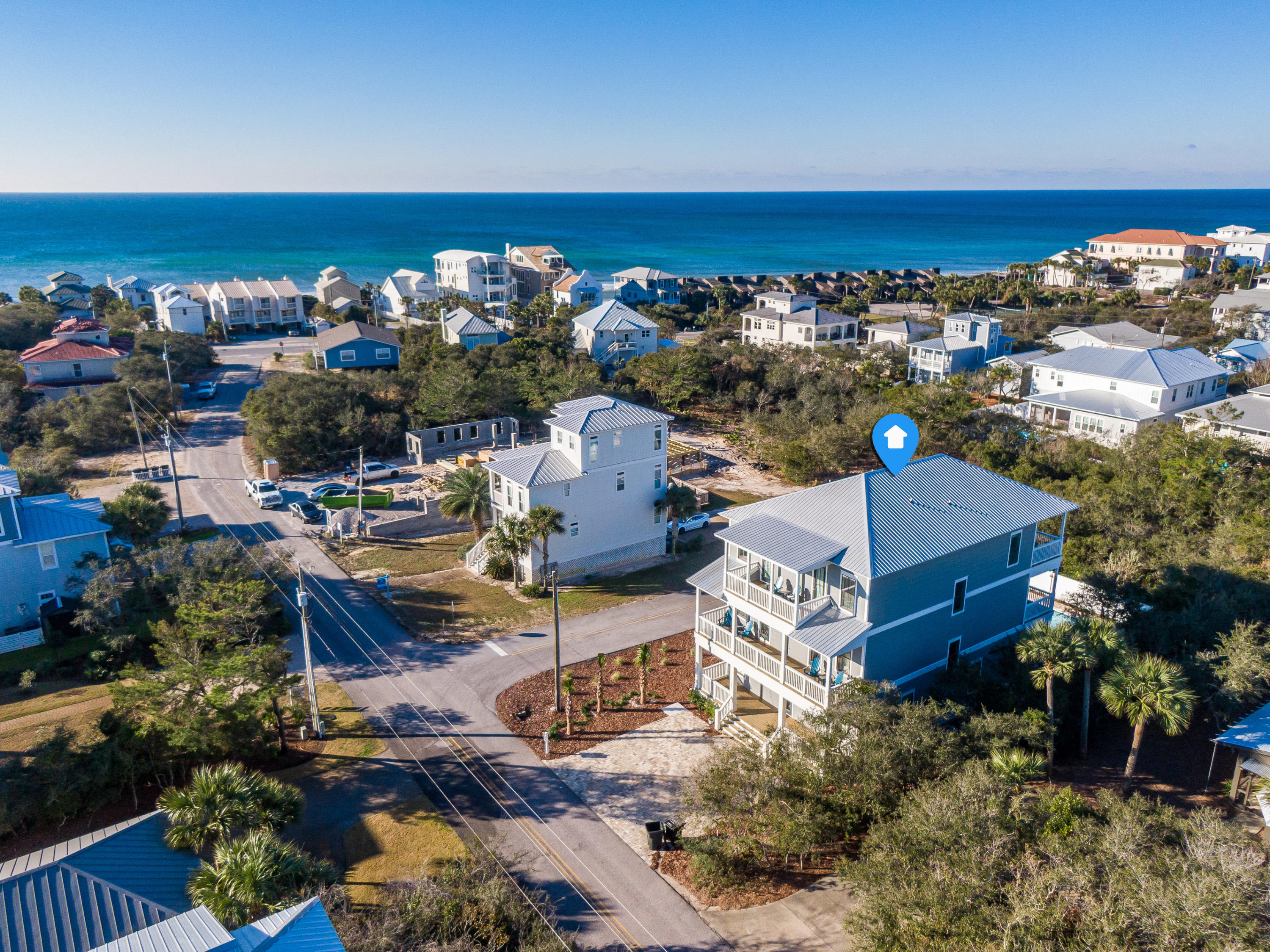 Offering inimitable serenity and privacy while remaining geographically poised minutes from all of the world-class dining and entertainment venues 30A has to offer, 101 A Street is the epitome of a coastal retreat. The thoughtfully designed floor plan encompasses three levels with 4,600 square feet of living space and over 1,500 square feet of covered porch area. The outdoor area is synonymous with relaxation boasting a private pool with custom paver decking, sunbathing ledge, fire pit, and outdoor dining area. With deeded beach access conveniently located at the end of A Street, the turquoise hued water and white sugar sand is steps away. The first floor features a spacious living area, chef's kitchen, dining room, and guest bedroom with ensuite.