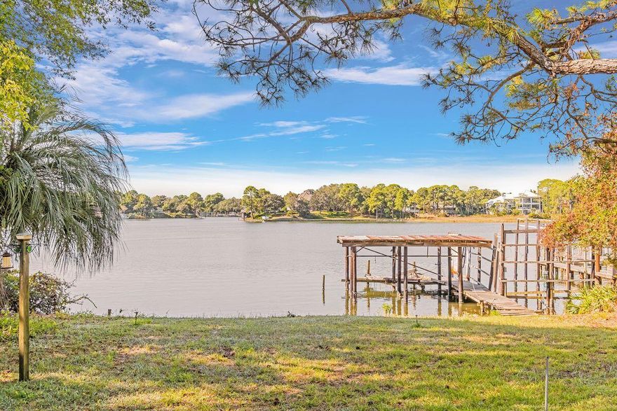 Family-owned since 1970, this unique property on Joe's Bayou is all about privacy in a stunning waterfront location. Keen boaters, fishing enthusiasts and water sportsmen will envy the dream lifestyle this .9 acre property offers in old Destin. The exclusive waterfront location includes a boat house and a 100-ft. dock for lining up your boats and water toys on the highly desirable deepwater bayou. The original home and dock are in need of renovation or a rebuild, but there's heaps of potential. The flexible floor plan currently has two large indoor living areas spilling outside onto an entertaining deck with endless views across Joe's Bayou. There's a spacious family kitchen for creating your own chef-worthy domain.