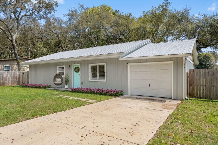 No fixer-upper here! This single-level home perfectly blends vintage charm with modern convenience. Built in 1960 and FULLY renovated in 2022, it features sleek LVP flooring (no carpet!), soft-close cabinets, tile backsplash, built-in shelving, and abundant natural light - every detail thoughtfully updated. Move-in ready with stainless steel appliances and even a lawnmower included. Situated on almost 1/4 acre with huge fenced yard. Gutters, additional garage storage, metal roof, 2023 HVAC, and 2018 water heater. Ideally located 6 miles from the beach, 7 miles to Eglin AFB, and 8 miles to Hurlburt Field, with quick access to dining and retail. Whether you're looking for a cozy home base, a low-maintenance getaway, or a smart investment...710 Leonard Road truly delivers.