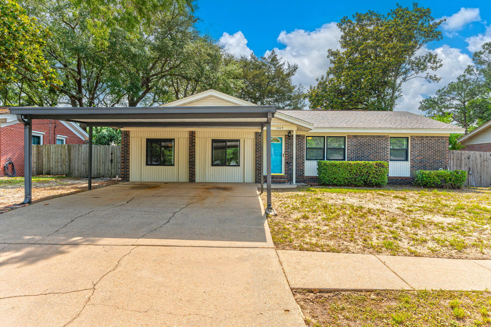 Charming home is located in the heart of Niceville. This home boasts an amazingly open and livable floor plan with the family room opening into the kitchen area, separate formal living room, and HUGE bonus room. The living space flows easily and lives large.  The bedrooms are all parquet wood flooring allowing the whole home to be carpet free! The backyard is a dream with  grassy area, shade in abundance, and even three fruit trees! There is also a concrete pad for your recreation equipment. Niceville Children's Park, library, boat ramp, and swimming access all within 1 mile! Perfect for your next home. Extra features include a tankless hot water heater, touchless kitchen faucet, keyless entry and recent HVAC replacement.