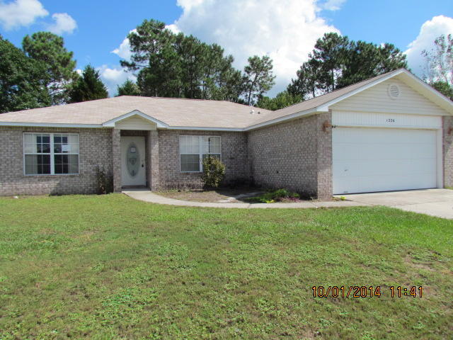 Great location, south Crestview. 4 bedroom, 2 bath contemporary house located in Northview Estates! This is a split bedroom floor plan house. When you enter the house the master bedroom and bath are to your left. The great room offers cathedral ceiling and planter shelves with the back door to the patio. The master bathroom has a large walk in closet, separate linen closet and double vanity. The master bedroom is a good size. The kitchen offers a lot of counter space and cabinets. There is a pantry in the kitchen and an island as well. Property being sold 'as is'. Buyer to verify all pertinent information to satisfy themselves.