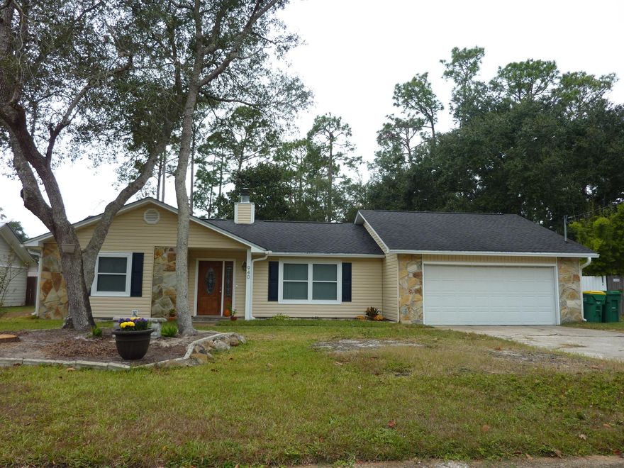 LOVELY UPDATED 1-STORY HOME! LOTS OF LIVING SPACE - THE GREAT ROOM FEATURES A SOARING CATHEDRAL CEILING AS WELL AS A STONE WOOD-BURNING FIREPLACE. SUPER KITCHEN HAS LOTS OF OAK CABINETS, GRANITE COUNTERS, STAINLESS STEEL GAS STOVE. DINING ROOM ADJACENT. MASTER SUITE HAS A BIG WALK-IN CLOSET. TWO ADDITIONAL BEDROOMS. WOOD LAMINATE AND TILE FLOORS THROUGHOUT. PRIVACY FENCED BIG BACKYARD WITH STORAGE SHED. 2-CAR GARAGE WITH AUTO OPENER.