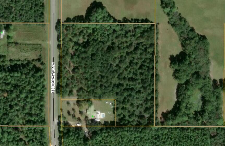 This 8.7-acre wooded property is zoned Rural Village, and it allows residential use with a density allowance of 2 dwelling units per acre. The land offers a blend of privacy, natural beauty, and development potential. In addition to its residential zoning, the zoning allows for the possibility of commercial use, subject to local planning and zoning approvals. This adds flexibility for mixed-use development or small-scale commercial ventures that complement the rural character of the area.It is the buyer's responsibility to verify all information concerning zoning, use, development potential, availability of utilities, and property dimensions.