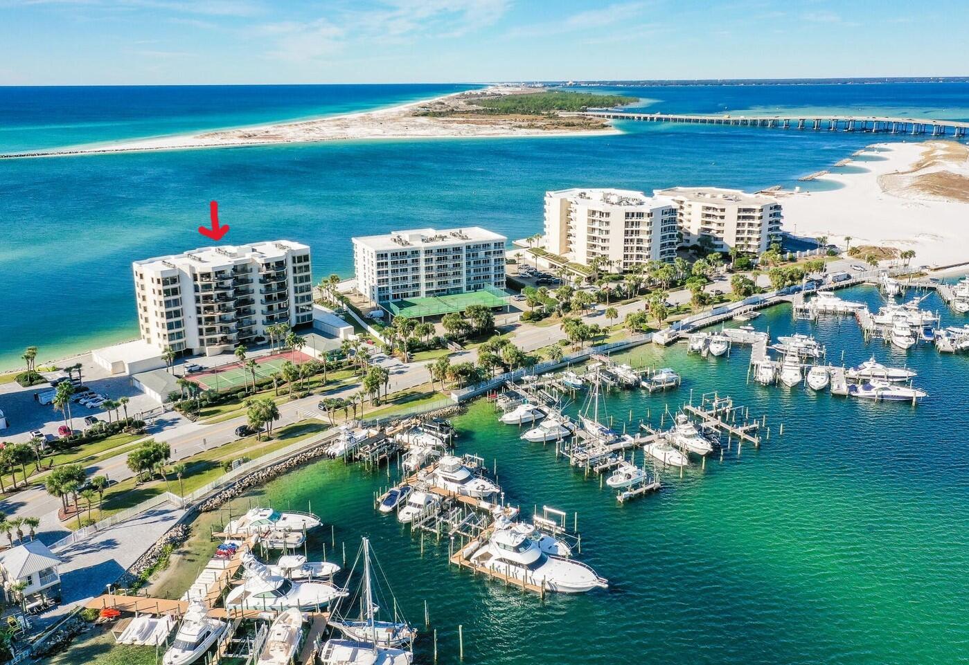 Rare, exclusive opportunity to own a magnificent waterfront 4 BR, 3 BA end unit in Waterview Towers Yacht Club, a gated community on Holiday Isle in the heart of Destin. There are only three units per floor in WTYC, with a balcony on the Pass/Gulf side and a second balcony overlooking Destin Harbor. Major renovations in bathrooms, kitchen and bar emphasize the epitome of coastal luxury living. The master bathroom has a new glass shower, soaking tub, light fixtures, floor and wall tiles, plus a separate toilet area and expanded master closet. The second and third bathrooms have been recharged with new countertops, fixtures, lighting and refurbished cabinets. The kitchen and bar countertops are renovated, plus lap board siding was added on front of the bar area. WTYC amenities include pools