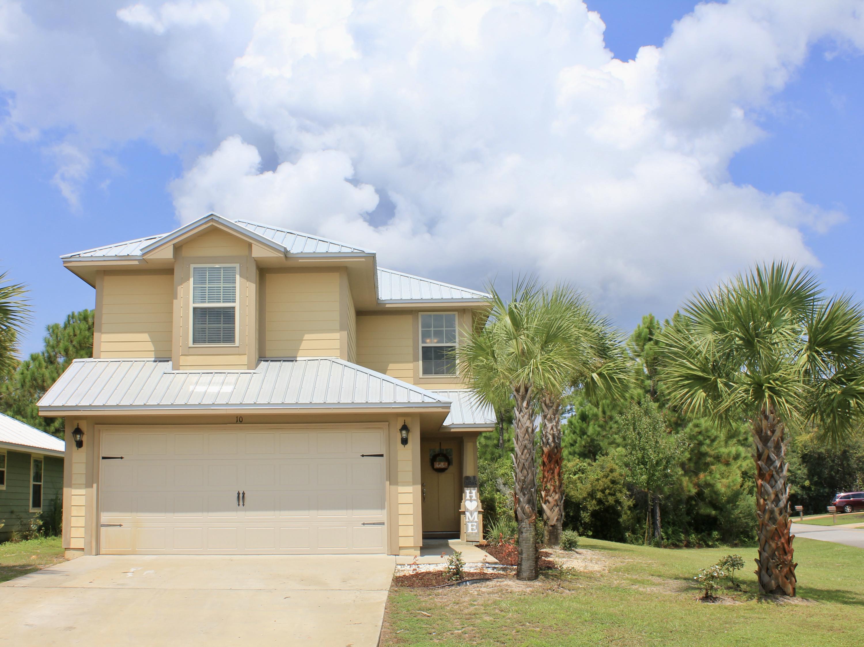 Beautiful move in ready home in the desirable Eagle Bay Subdivision! Walk to Bay access - just 2 blocks away. 3BR/2.5 bath two story home on corner lot! Great location just minutes away from Sacred Heart Hospital, our beautiful white sand beaches, restaurants and stores. This home offers hardiboard with metal roof, 2 car garage, sprinkler system with well, hurricane window, granite in kitchen and baths, bull nose corners, Moen fixtures, GE stainless appliances and more.